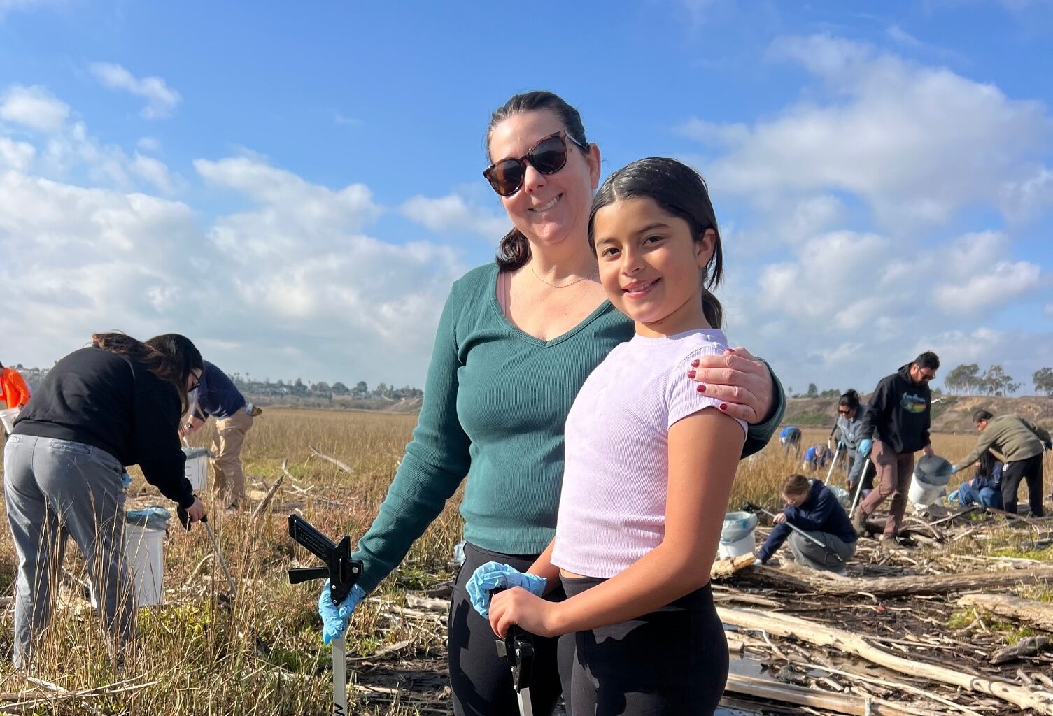 Volunteers take part in a previous Inside the Outdoors cleanup event at Upper Newport Bay in Newport Beach.