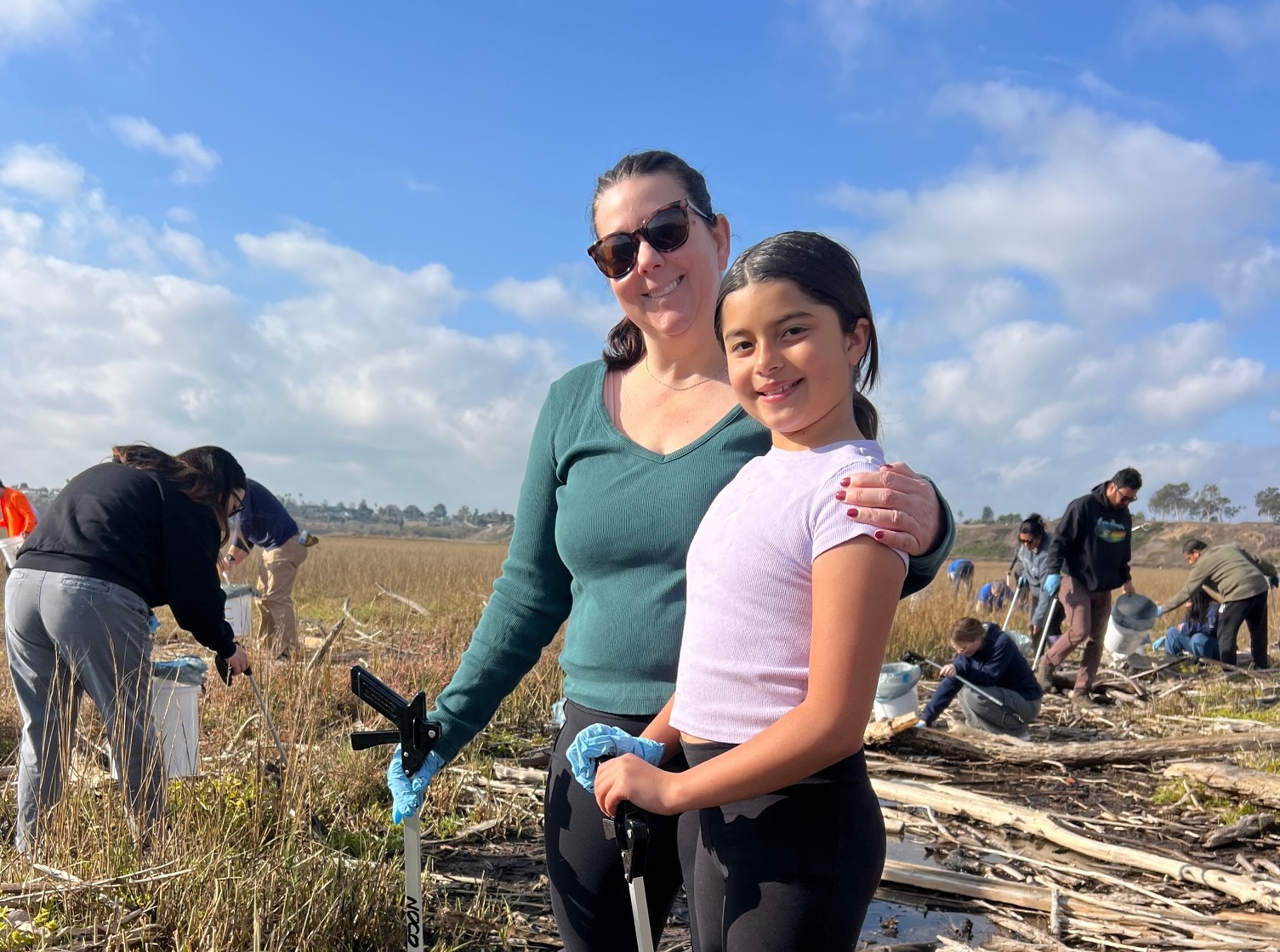 Volunteers take part in a previous Inside the Outdoors cleanup event at Upper Newport Bay in Newport Beach.