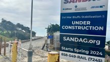 A SANDAG sign warns pedestrians of construction work on the train tracks near Seagrove Park, Del Mar, Calif., February 15, 2026.