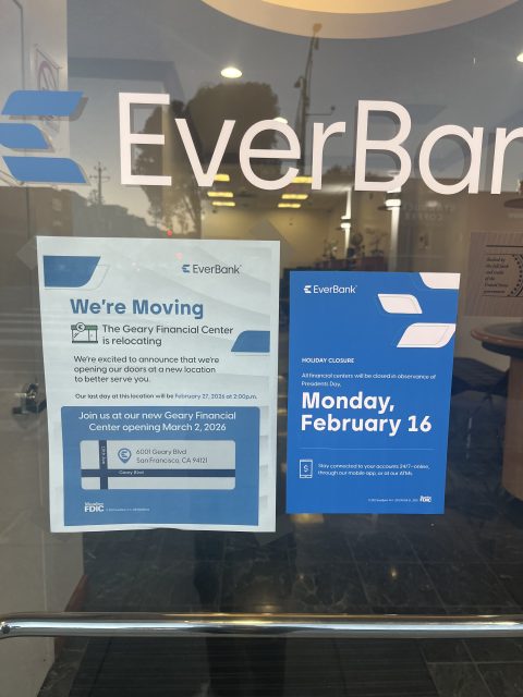 Two signs on a glass door announce EverBank’s relocation to a new address in March 2026 and a holiday closure on Monday, February 16.