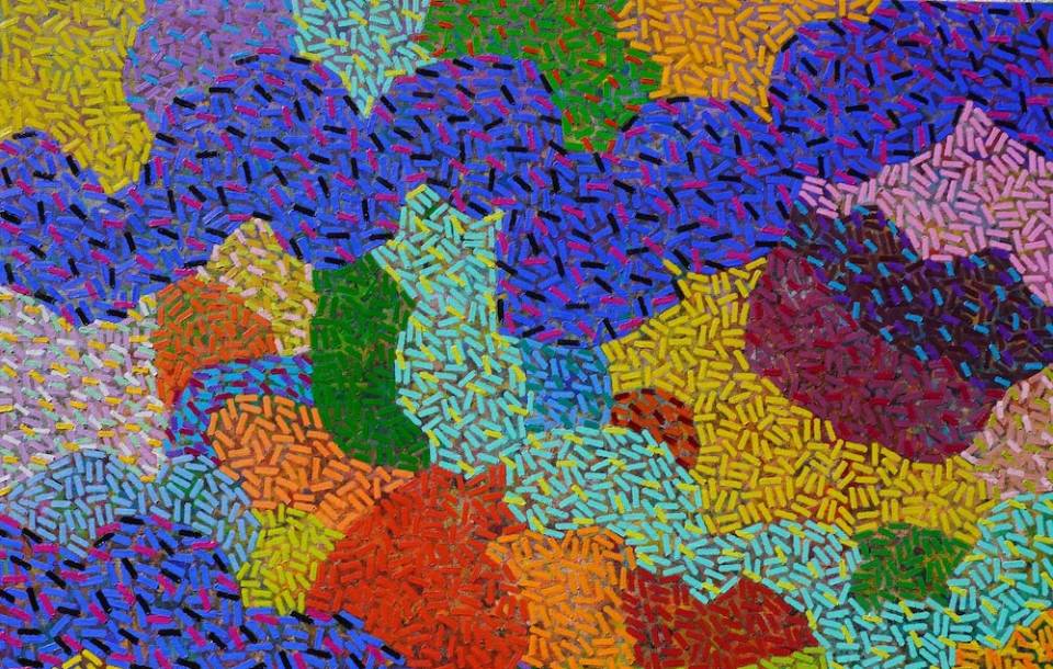 brightly colored swirls intersect with apparently bumpy texture