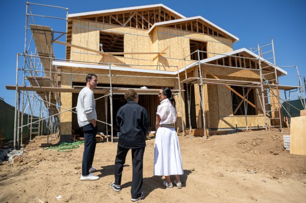 Mayor Karen Bass speaks with Walter and Alessandra Lopes outside their home that was destroyed during the Palisades Fire and is now being rebuilt in Pacific Palisades on Monday, May 19, 2025. Bass signed an executive order waiving all permit fees in Palisades. The Lopes are expecting a refund of the permit fees they paid to the city of L.A. (photo by Hans Gutknecht, Los Angeles Daily News/SCNG)
