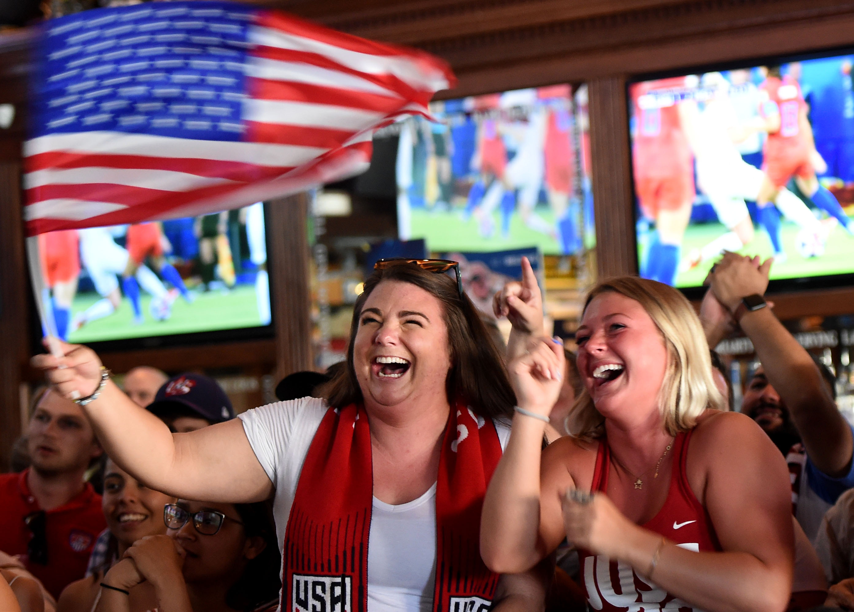 Candace Mowery and Amy Rogozinski celebrate inside Legends Restaurant and...