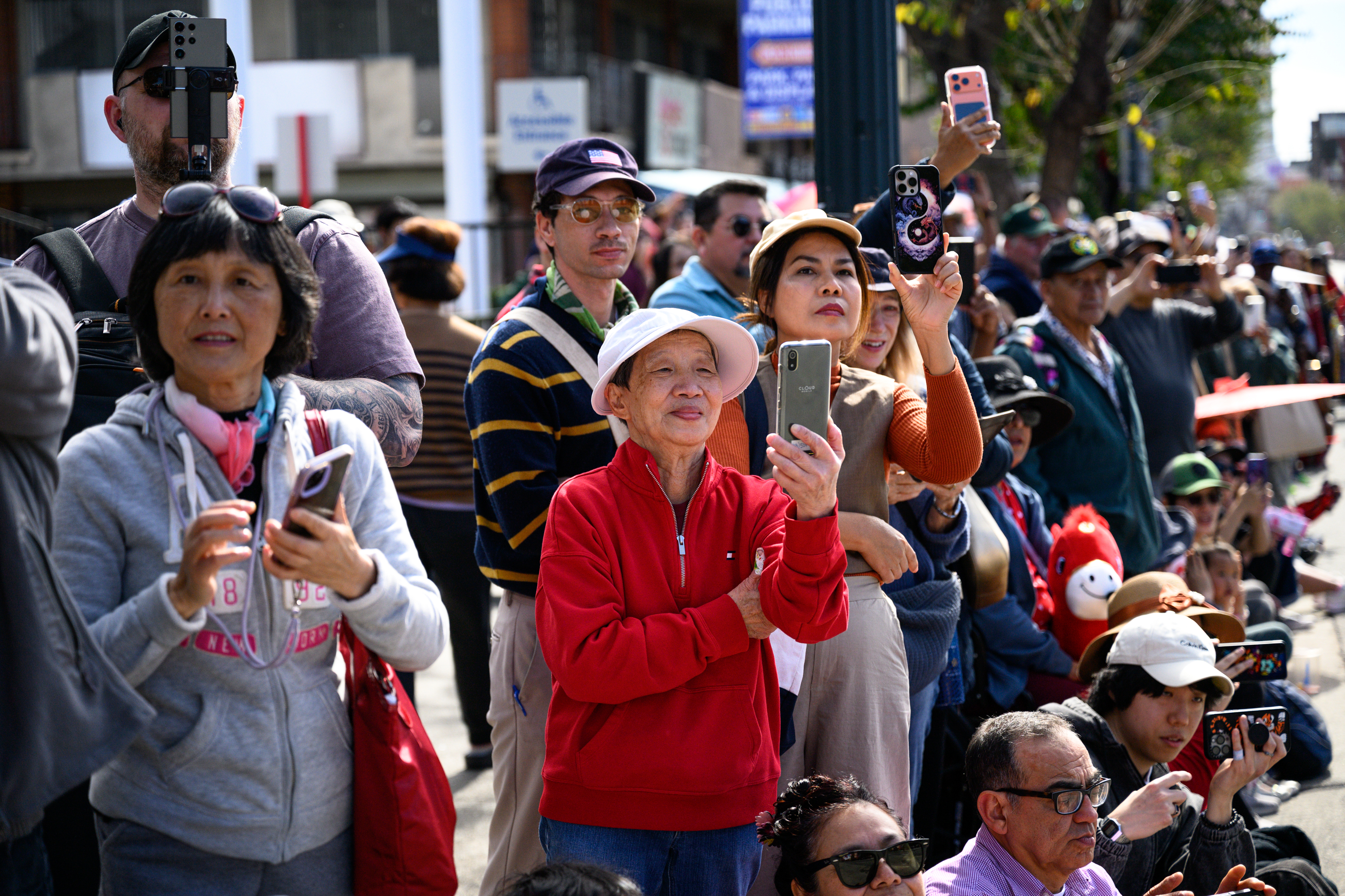 Spectators view the 127th Annual Golden Dragon Parade in Chinatown,...