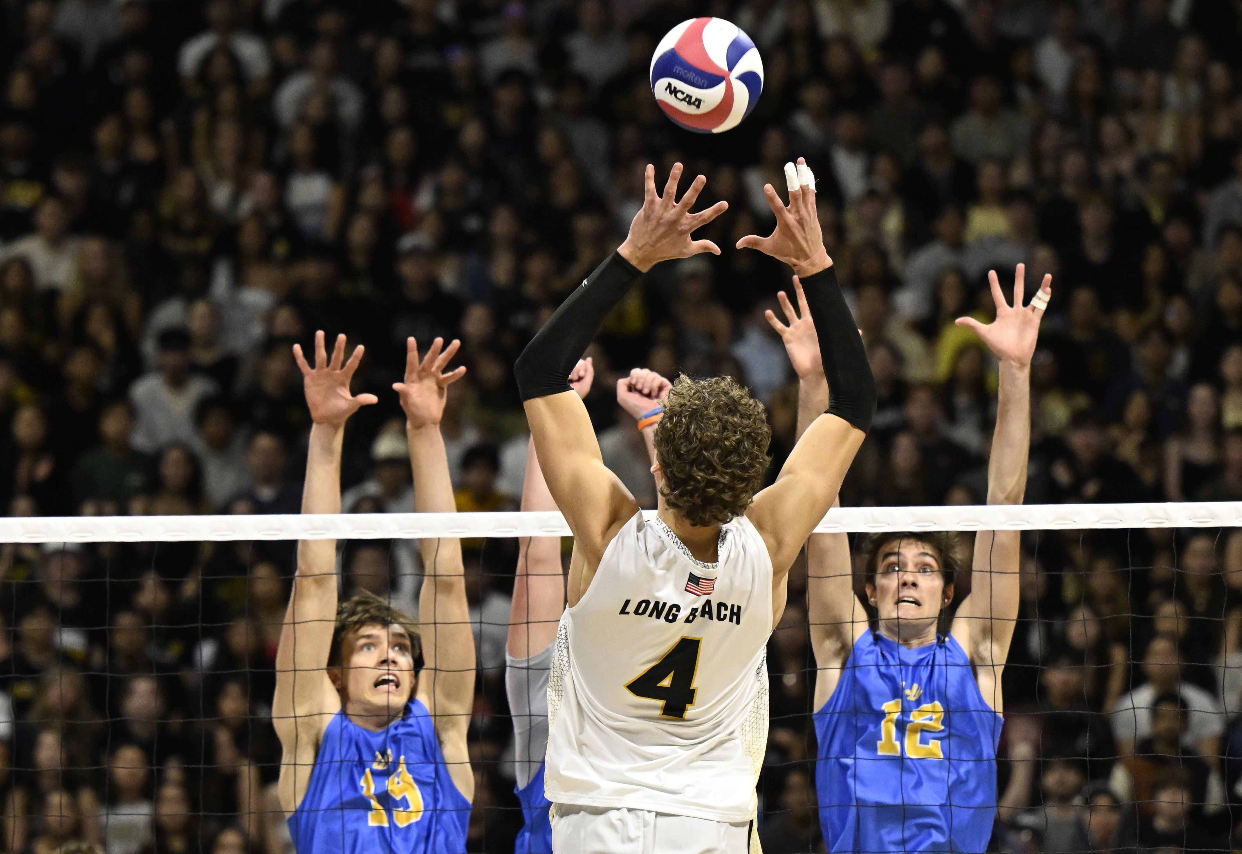 Long Beach State outside hitter Skyler Varga (4) returns a...