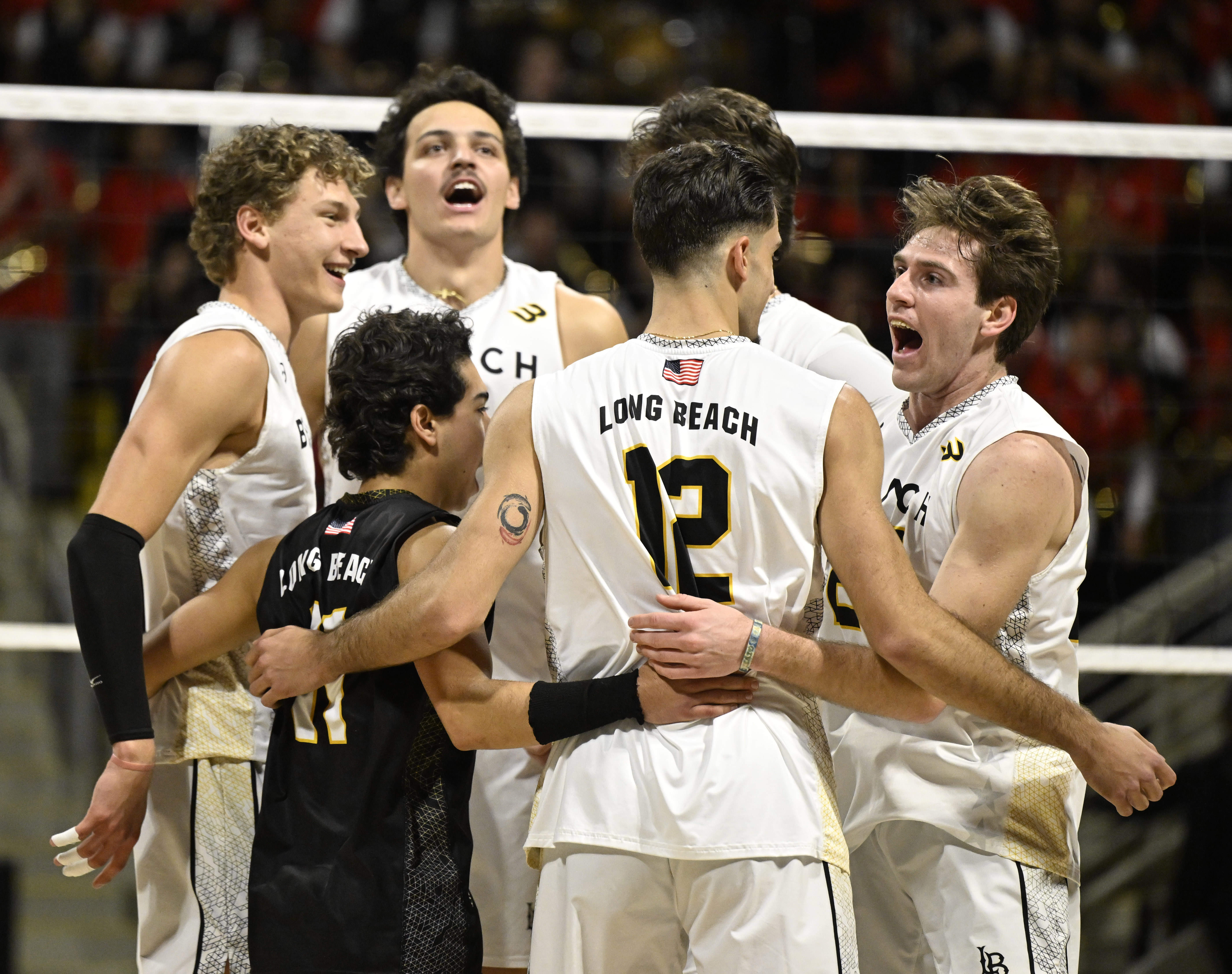 Long Beach State players celebrate after a point during the...