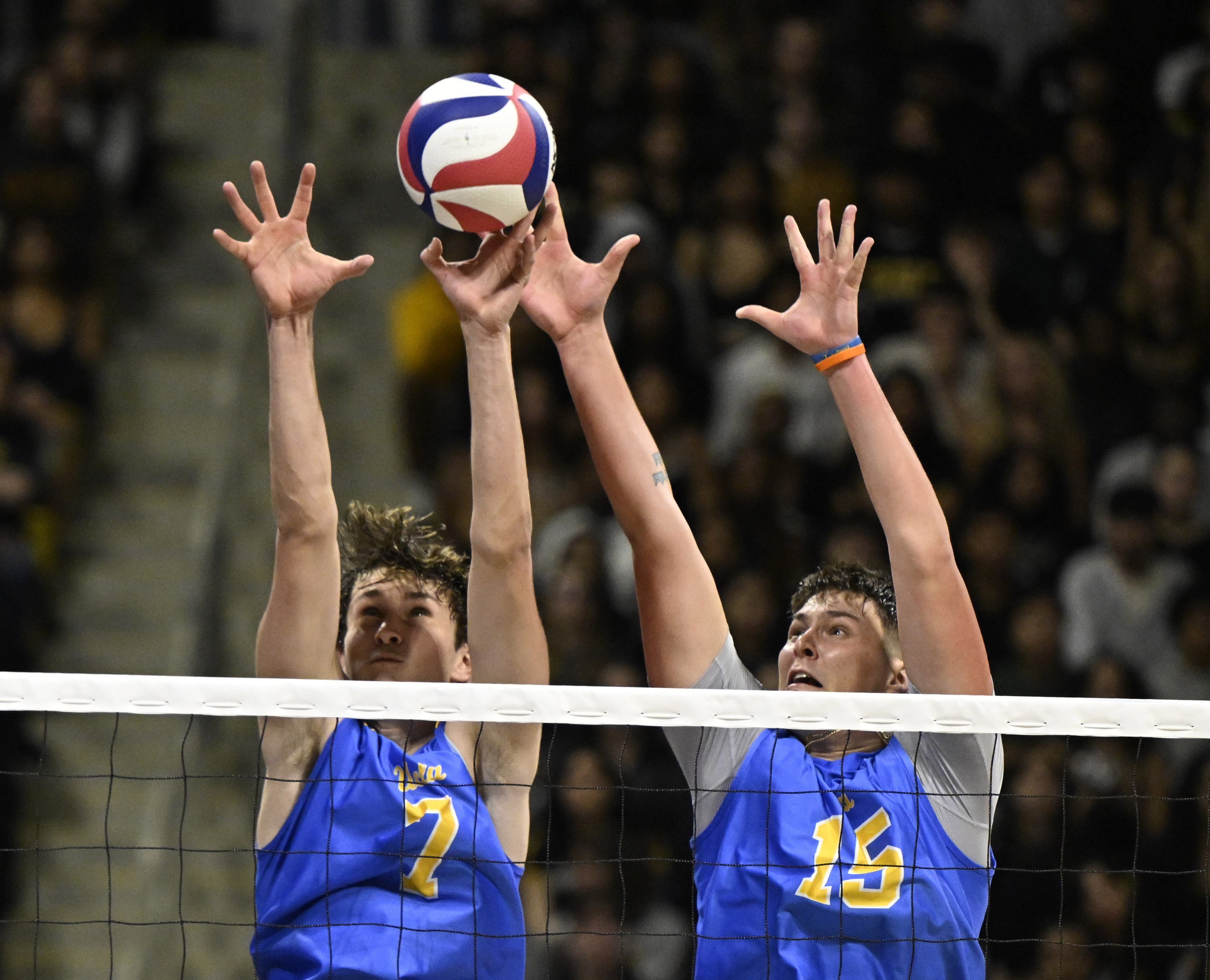 UCLA setter Andrew Rowan, left, blocks a Long Beach State...