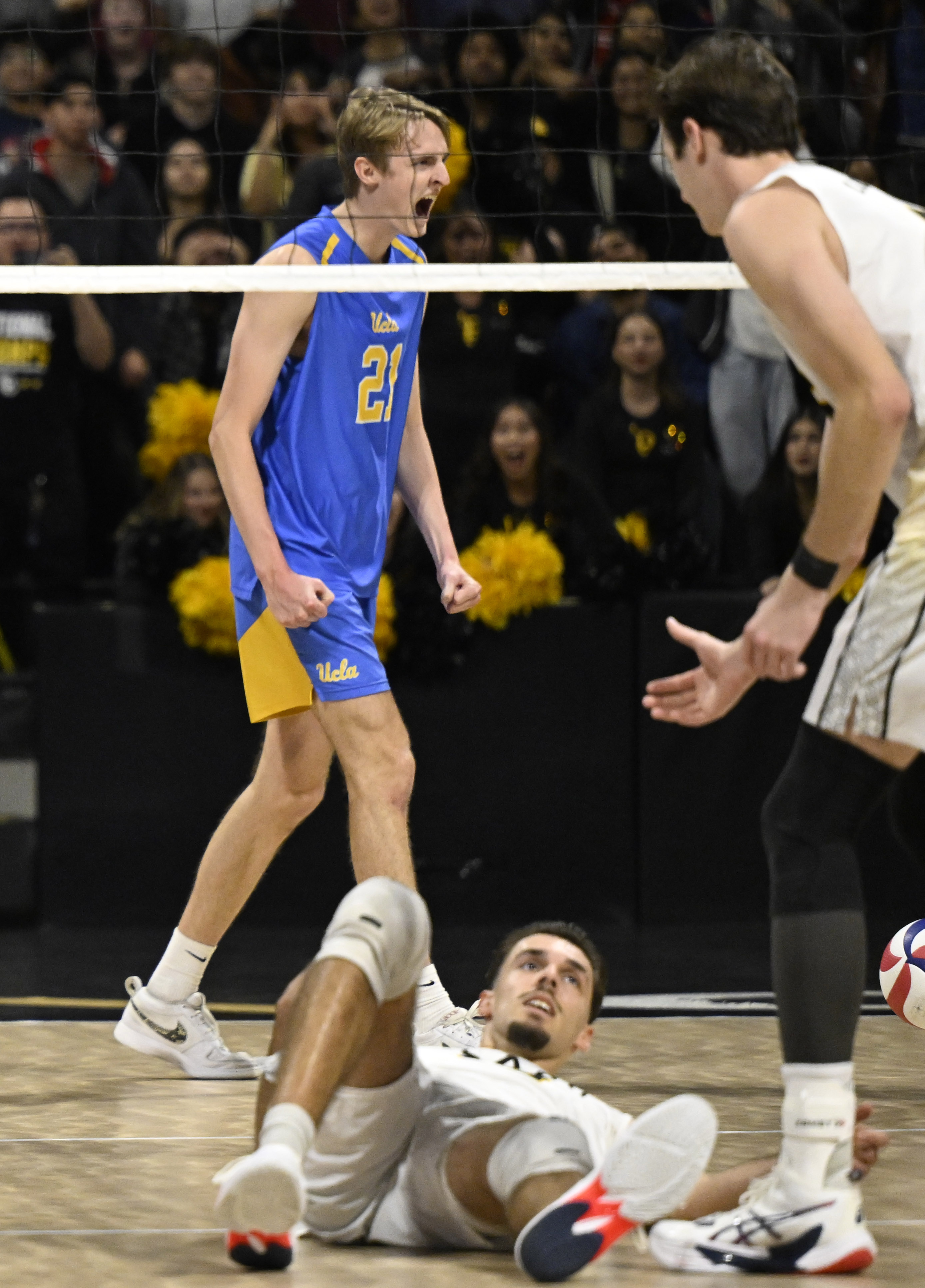 UCLA outside hitter Zach Rama (21) celebrates after a point...