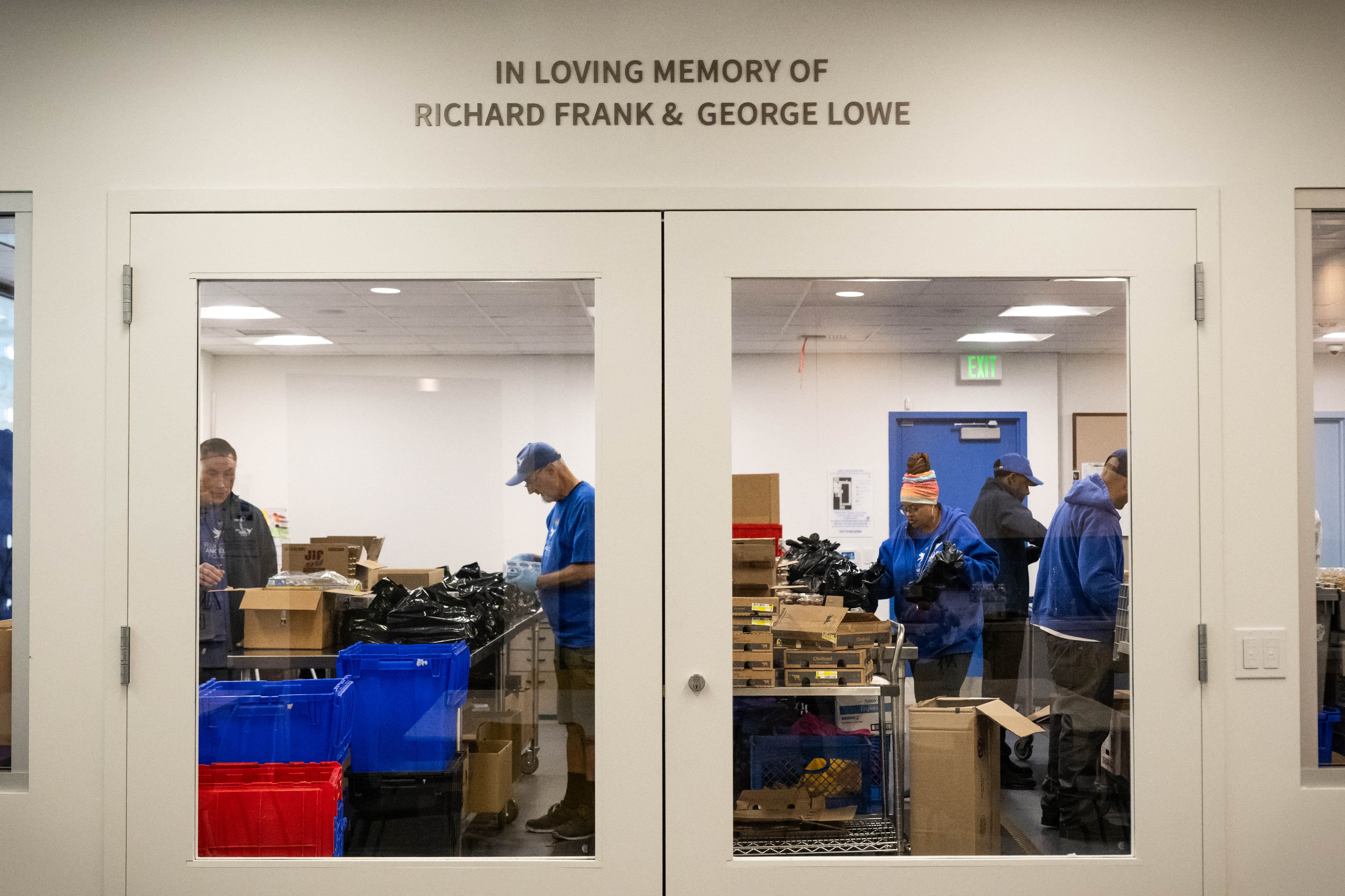 Project Angel Food employees pack meals adjacent to the Jamie...