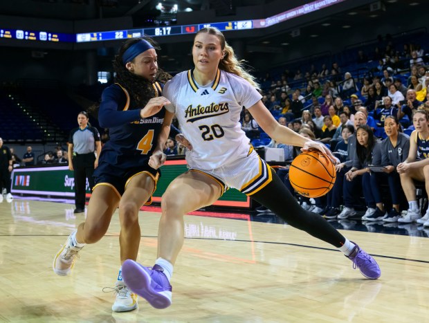 UC Irvine guard Hunter Hernandez, right, drives to the basket around UC San Diego guard Makayla Rose during a Big West game on Saturday, Jan. 24, 2026, at UCI's Bren Events Center. (Photo by Paul Rodriguez, Contributing Photographer)