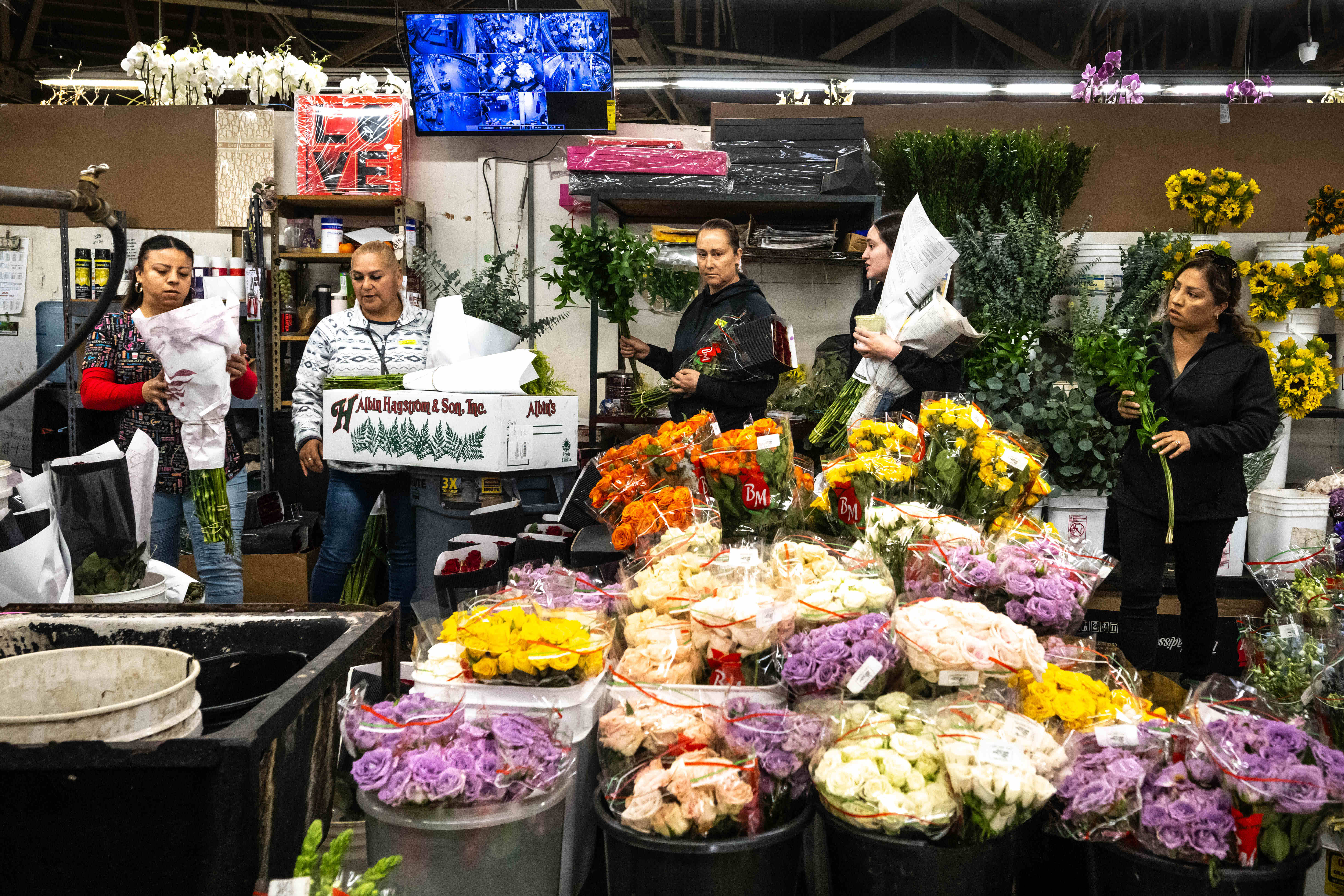 Getting ready for Valentineâs Day people shop for flowers at...