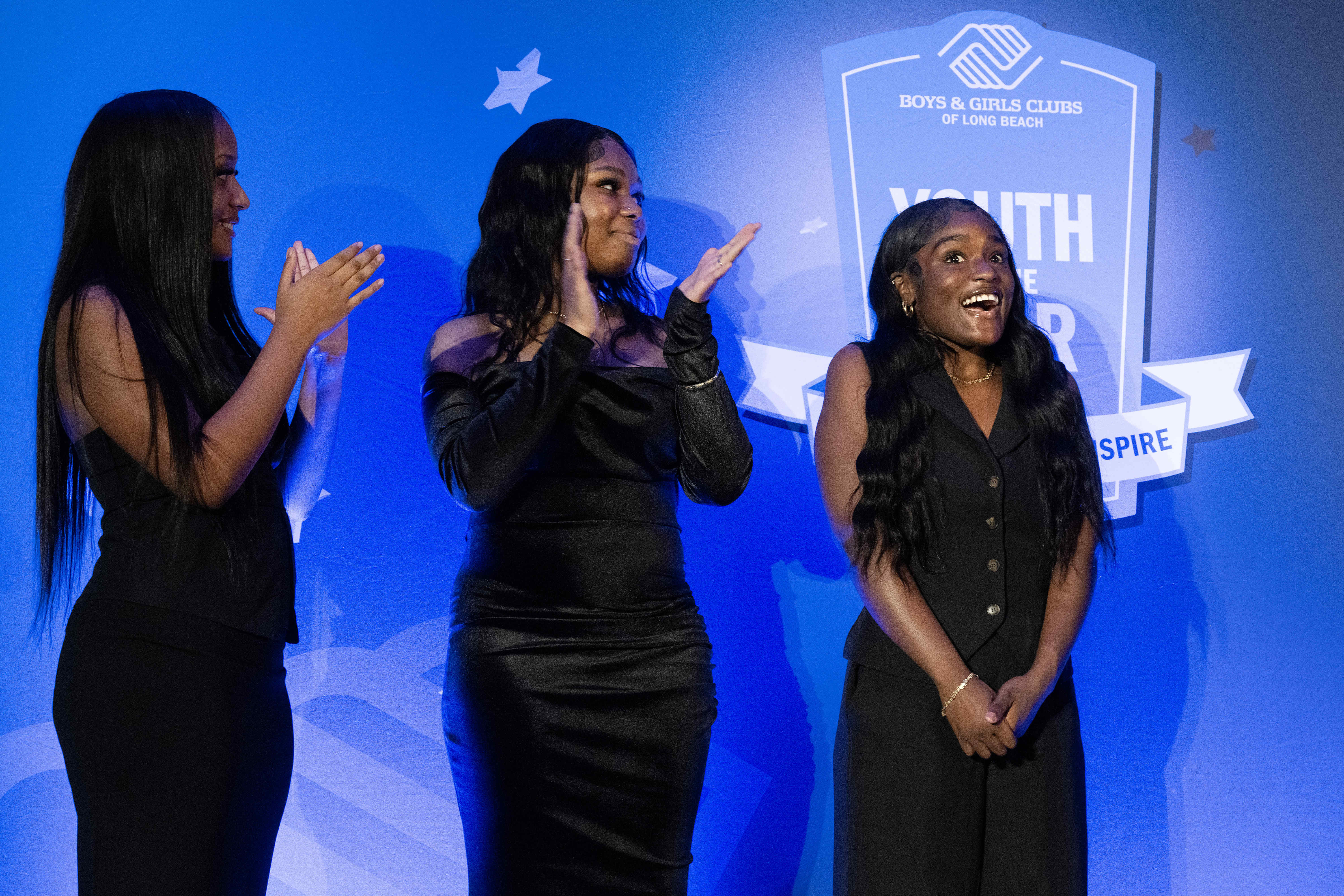 Samajahe King, right, receives the Youth of Year award during...