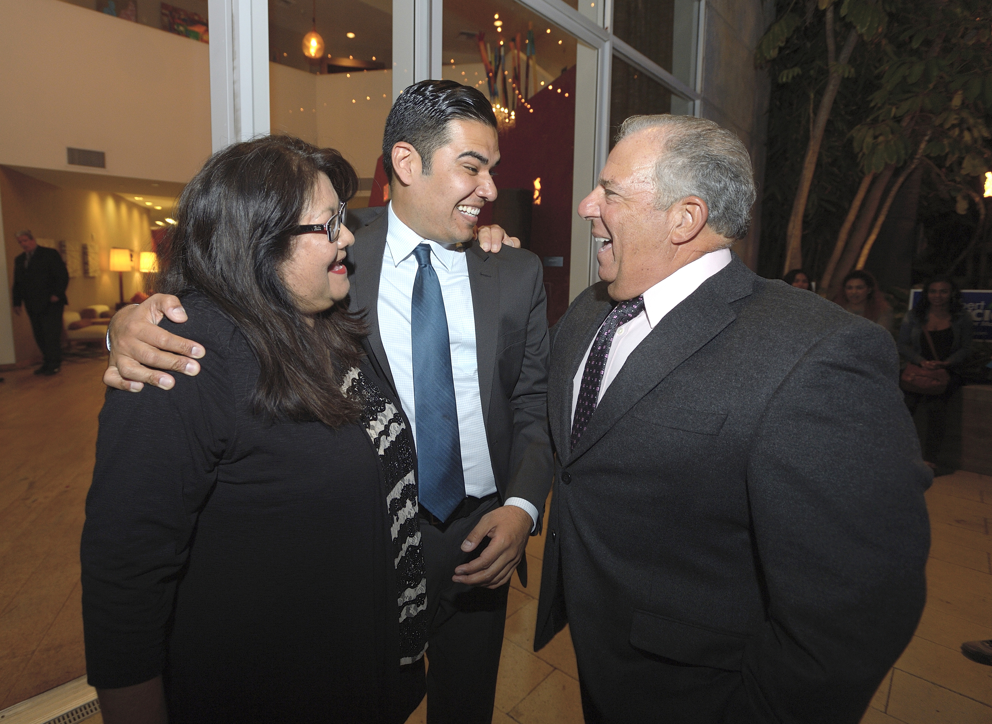 Long Beach mayoral candidate Robert Garcia, center, Garcia’s mother, Gaby...