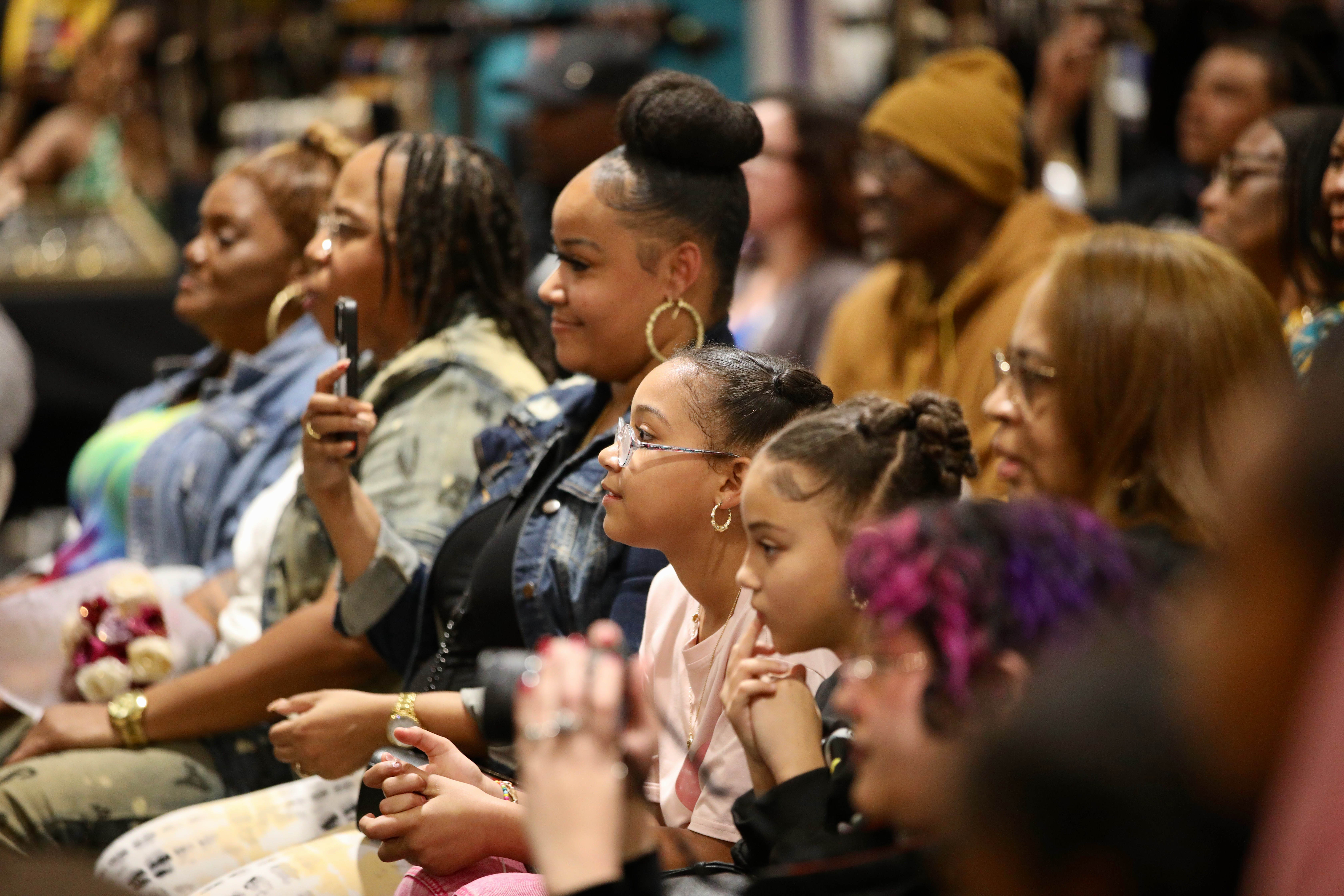 Attendees watch a dance performance at a Black History Month...