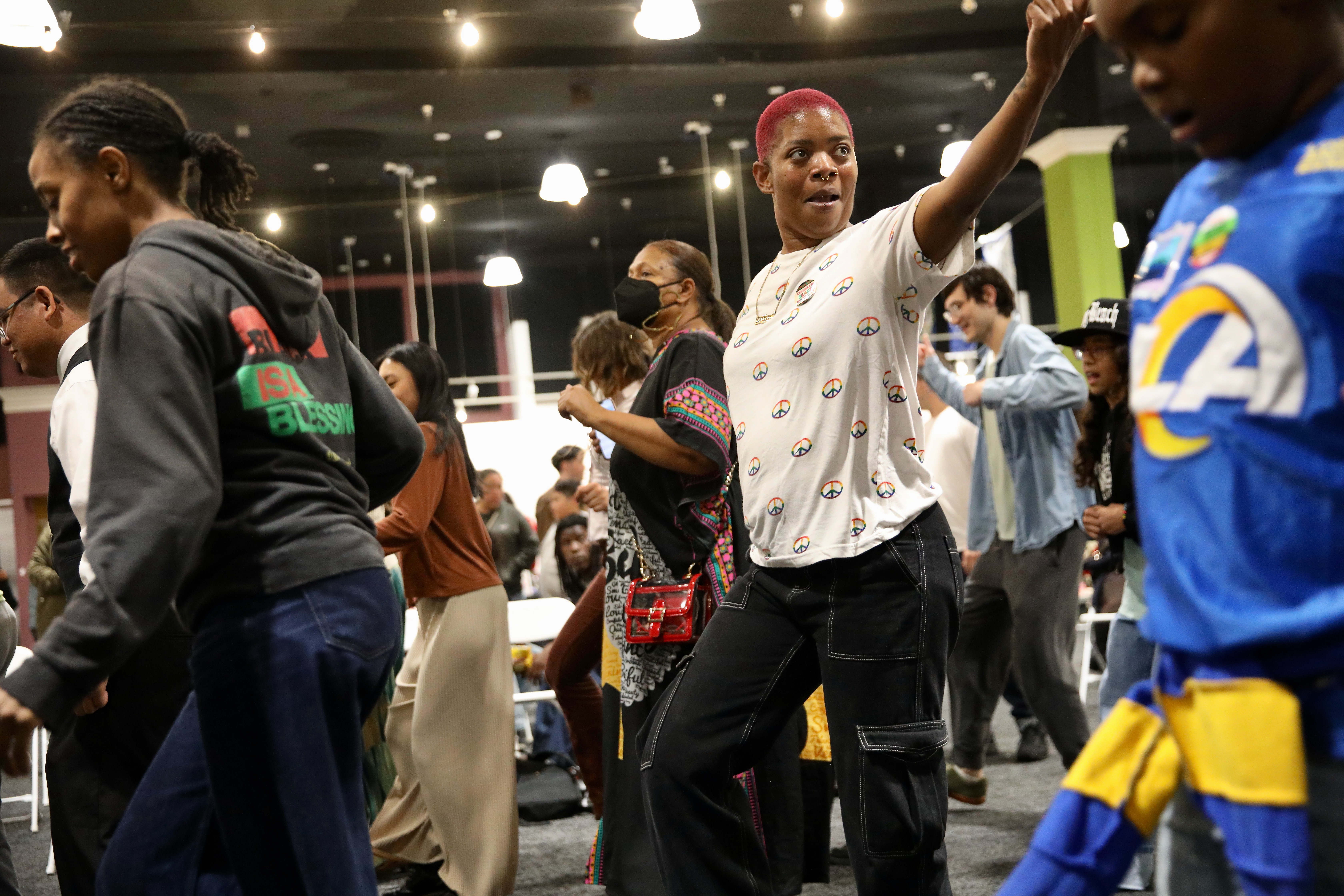 Attendees kick up their heels for urban line dancing at...