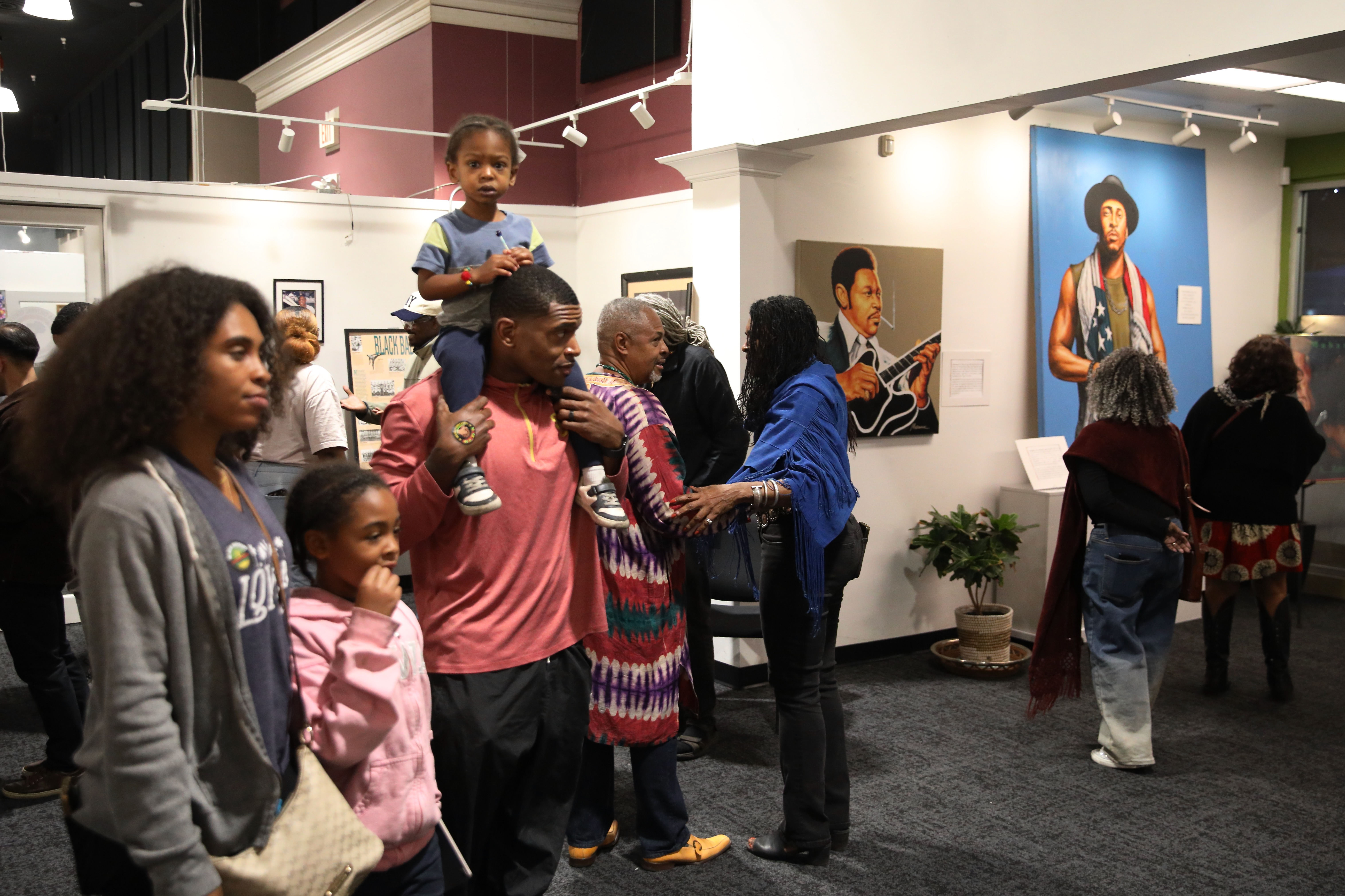 Attendees check out historical and cultural displays at the Black...