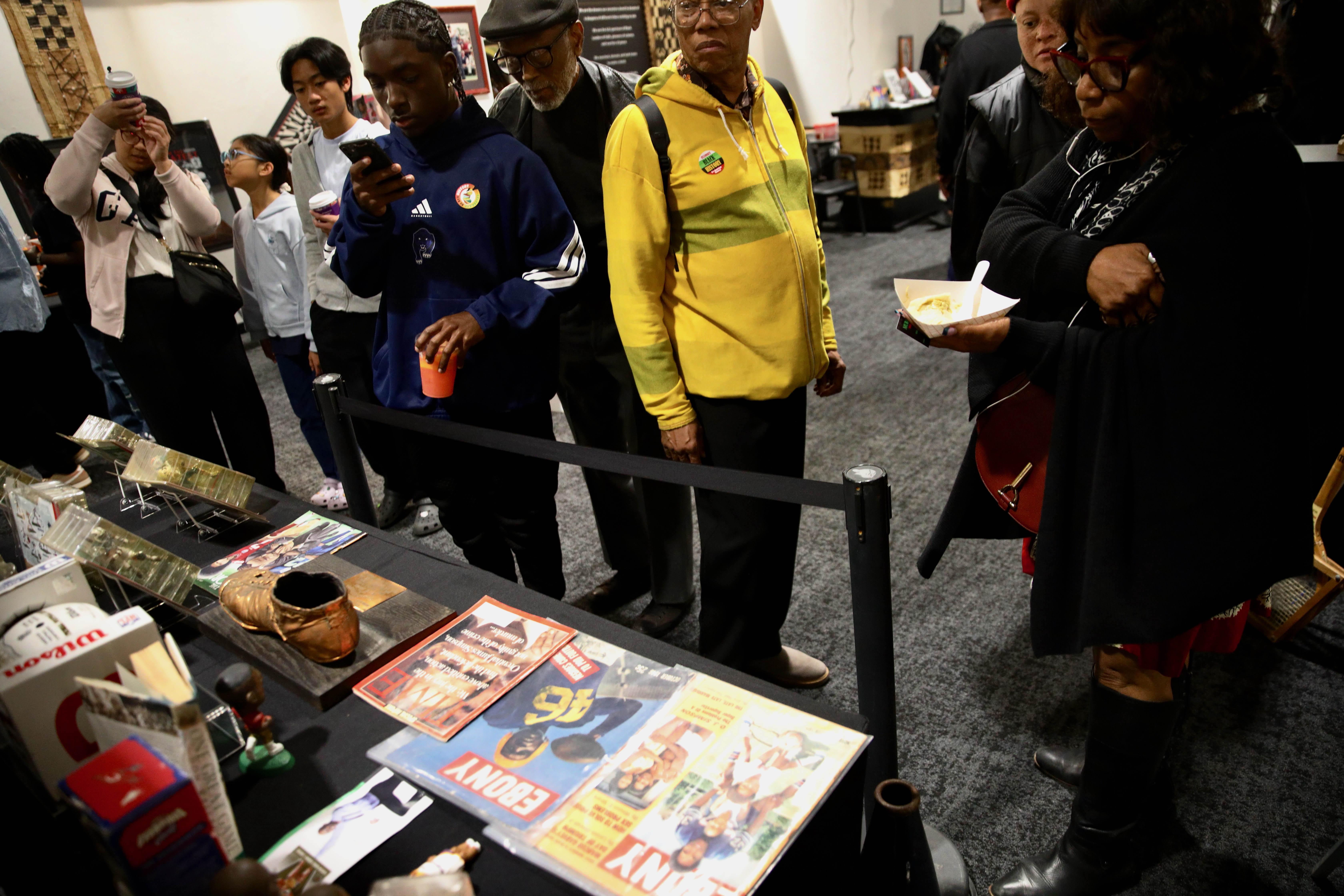 Attendees check out historical and cultural displays at the Black...