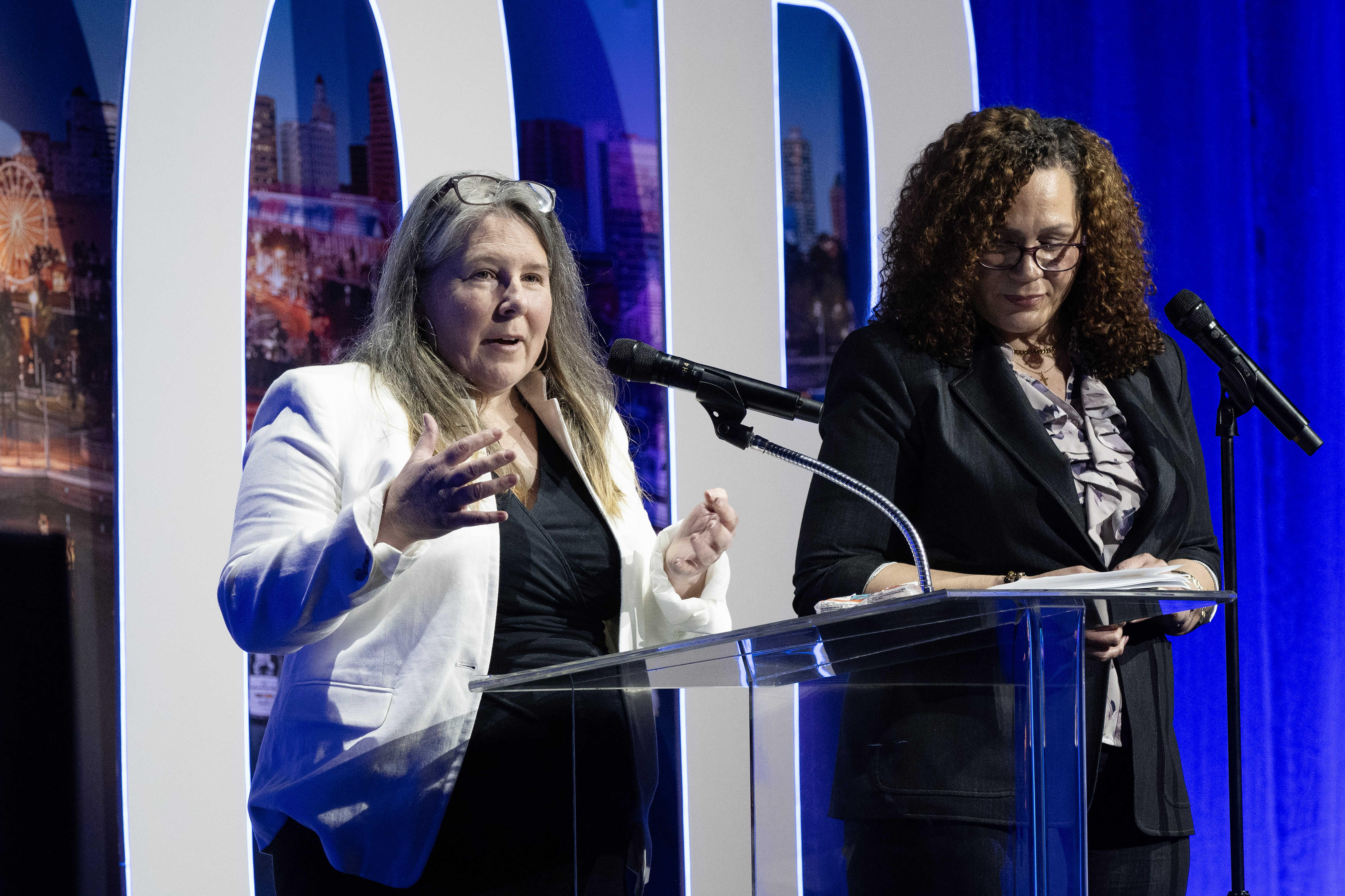 From left, Becki Ames and Lori Ann Farrell speak during...