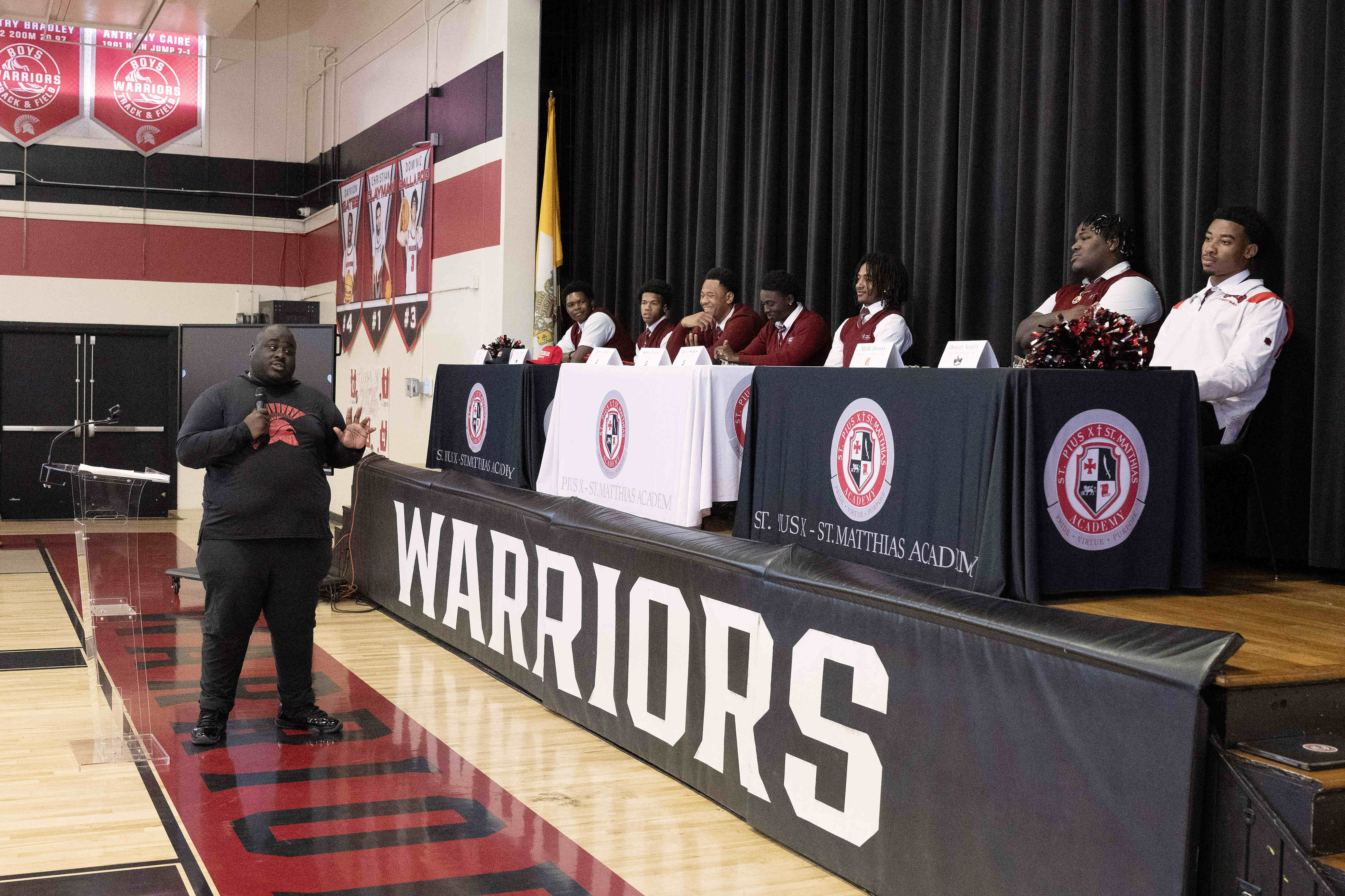 Head coach Devah Thomas, left, speaks during a National Signing...