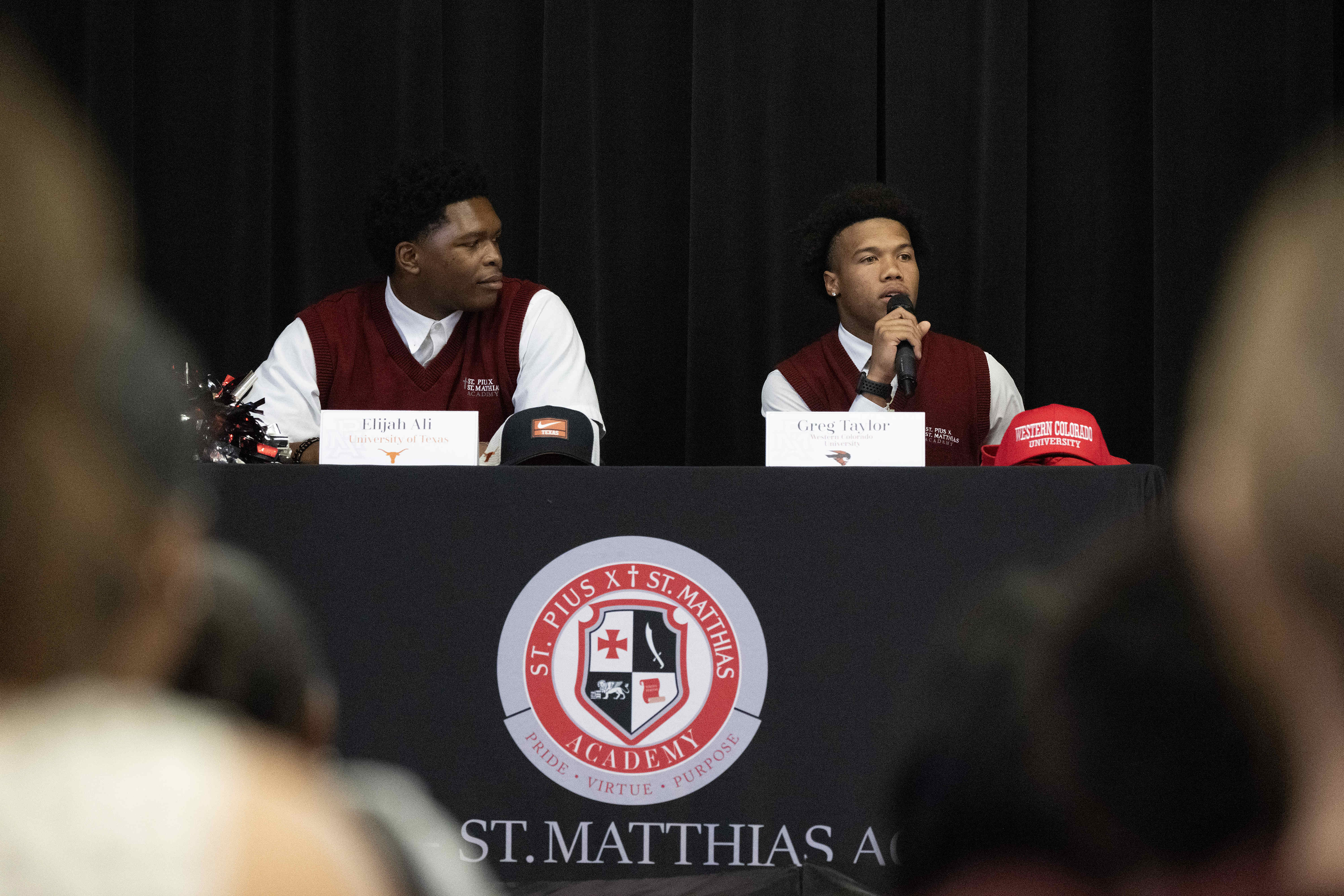 Gregory Taylor, right, thanks God during a National Signing Day...
