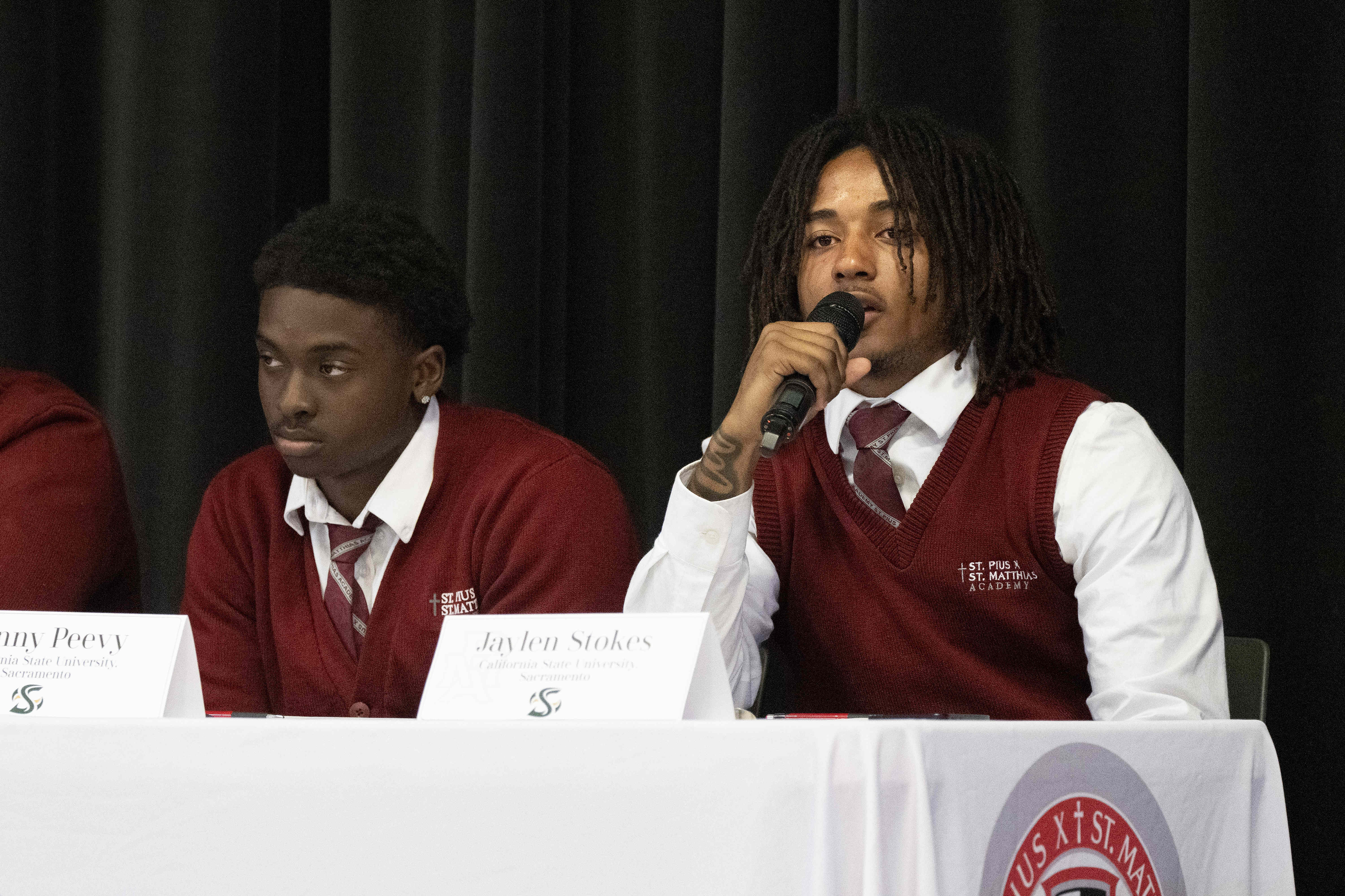 Jaylen Stokes, right, speaks during a National Signing Day ceremony...