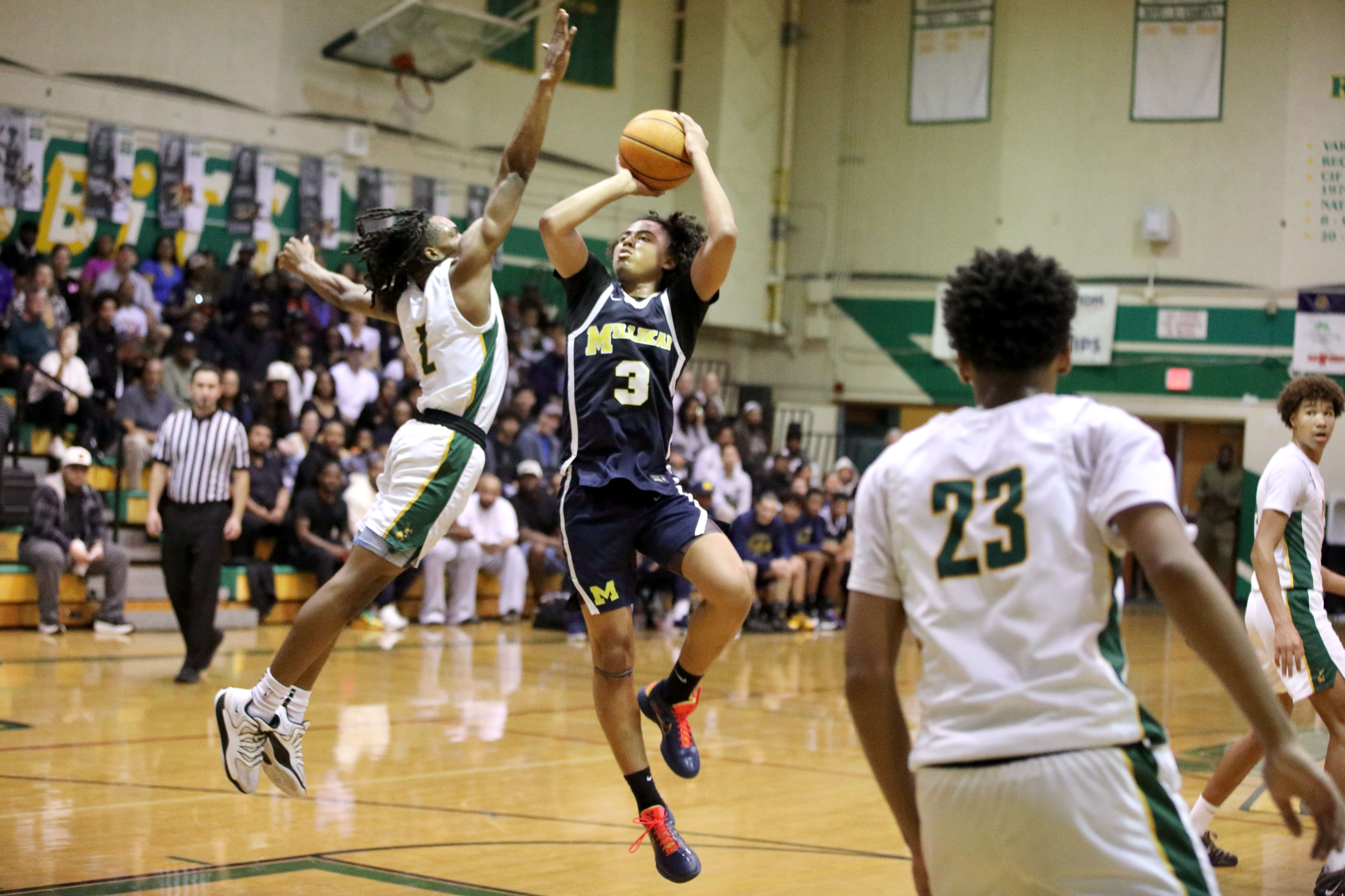 Millikan’s Joseph Wicker gets off a shot over Long Beach...