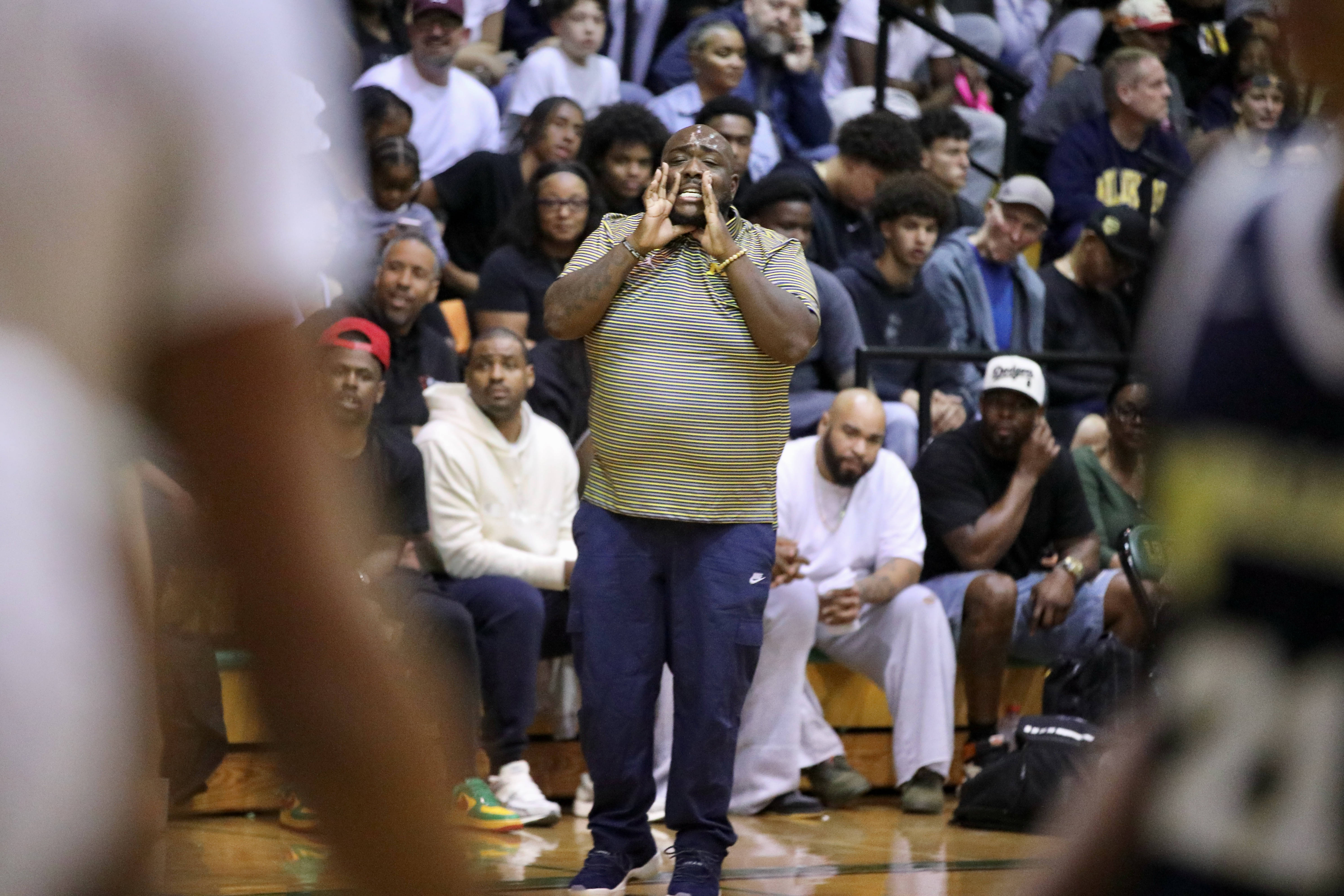 Millikan head coach Stephon Price yells out during his teamâs...