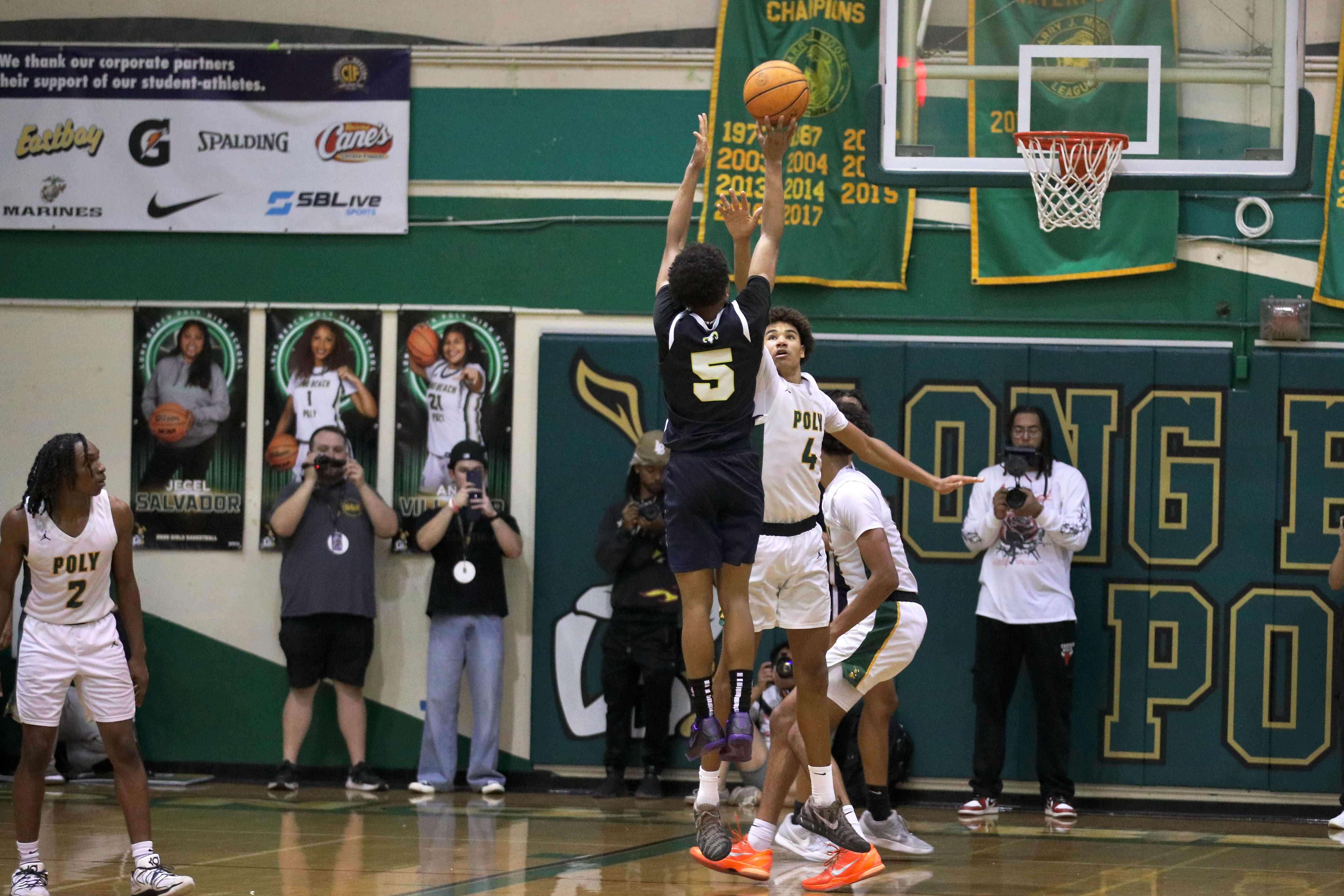 Millikan’s Quali Giran connects on a fourth quarter shot over...