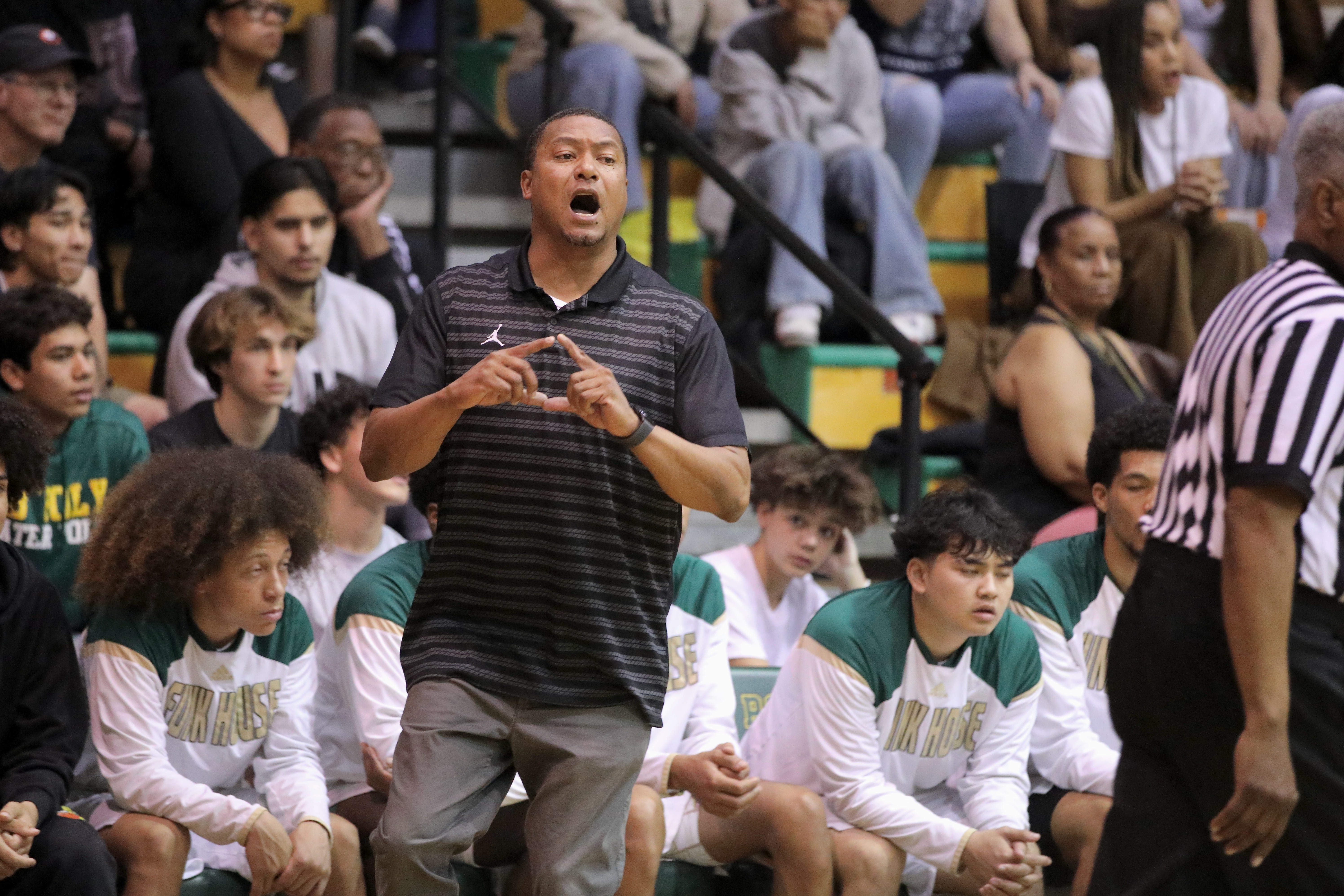 Long Beach Poly head coach Shelton Diggs calls out a...