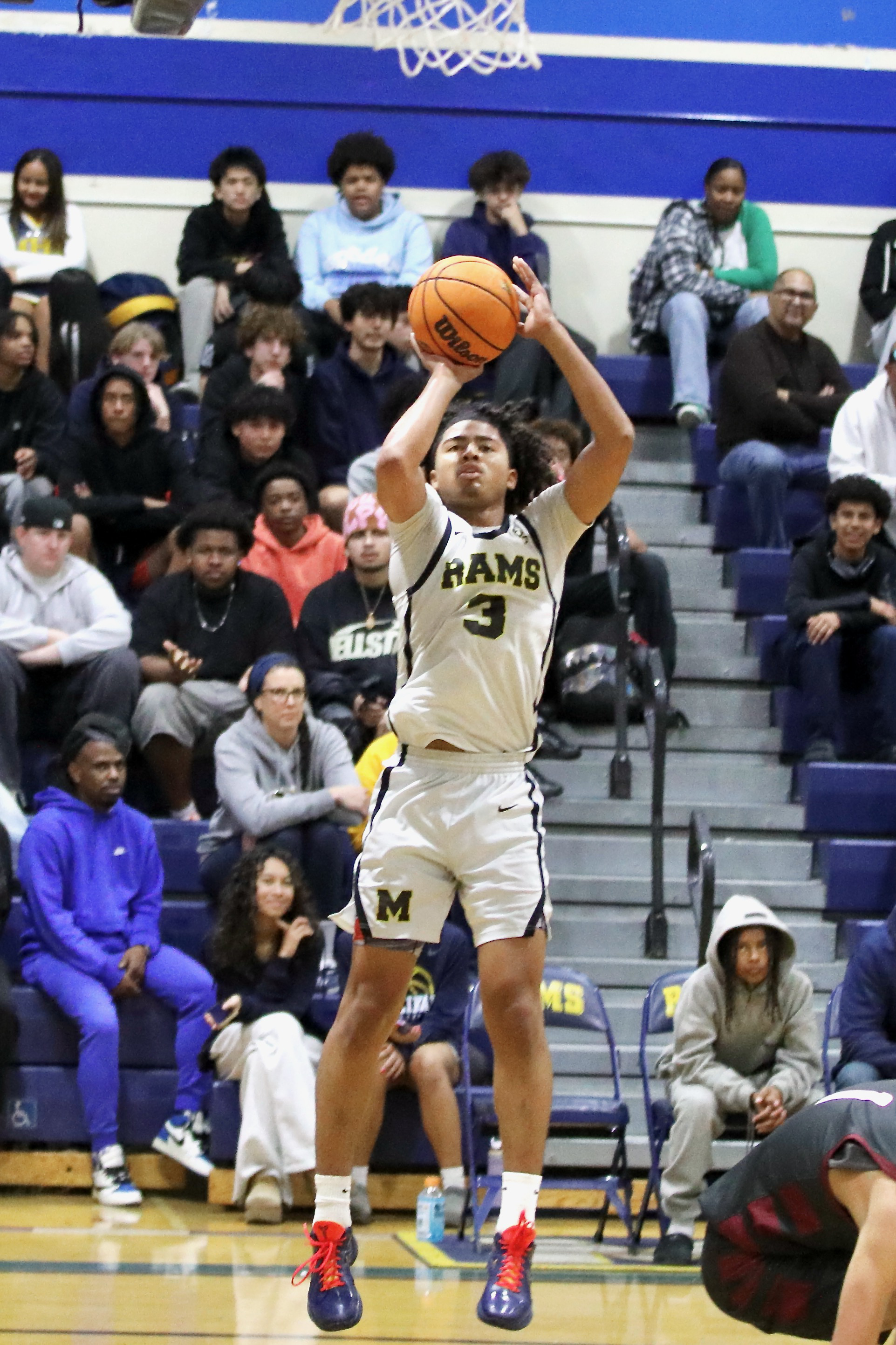 Millikan senior guard Joseph Wicker connects on a jumper against...