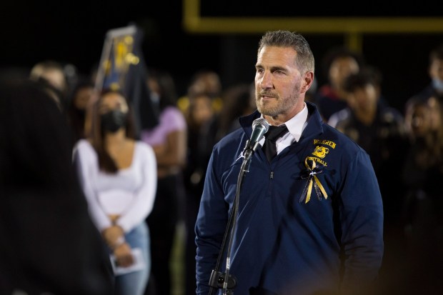 Warren football head coach Kevin Pearson speaks during a memorial for senior Jaylon Connish at Justice Stadium in Downey on Friday, March 11, 2022. (Photo by Drew A. Kelley, Contributing Photographer)