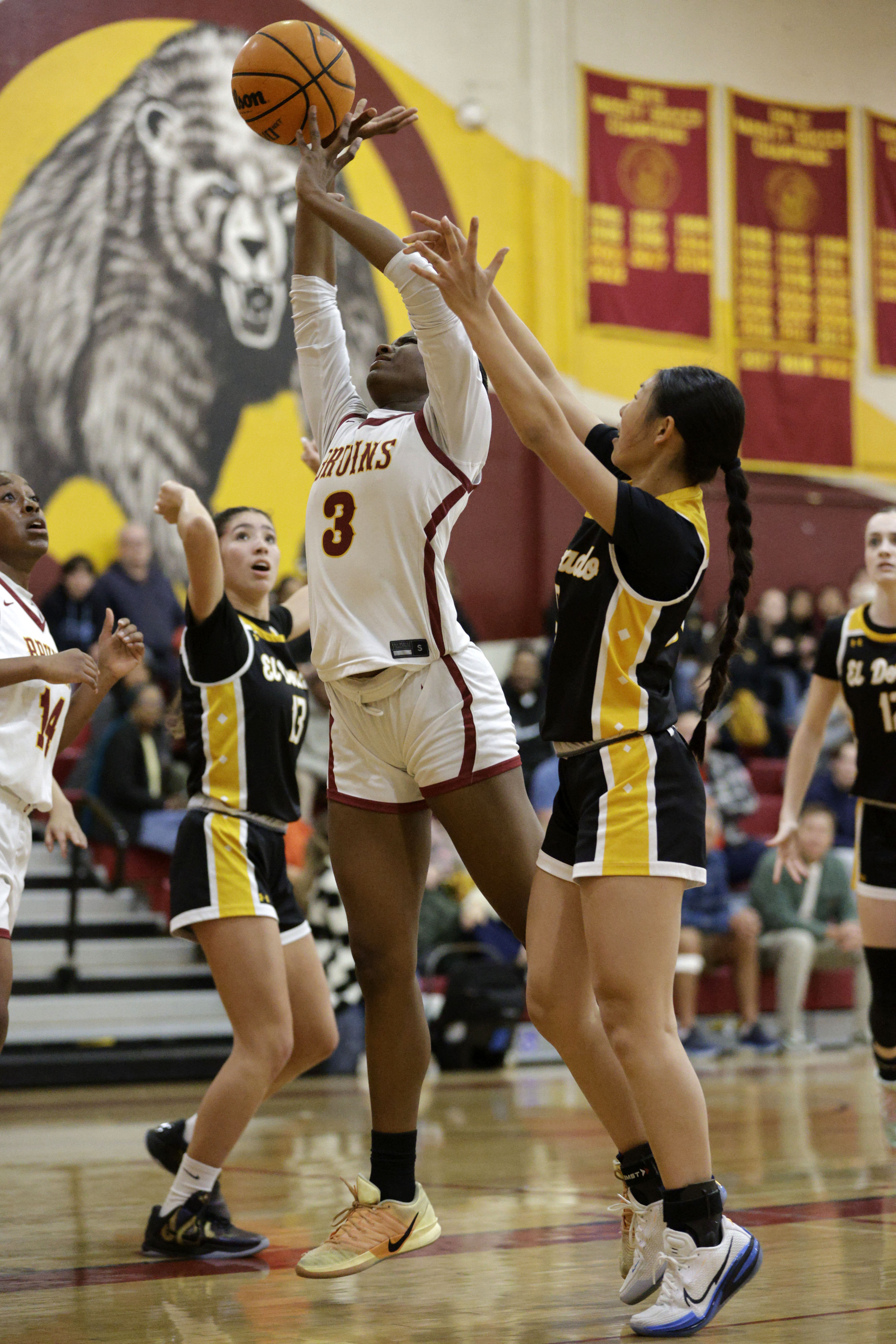 Wilson’s Jordyn Jefferson (3) shoots for two in front of...