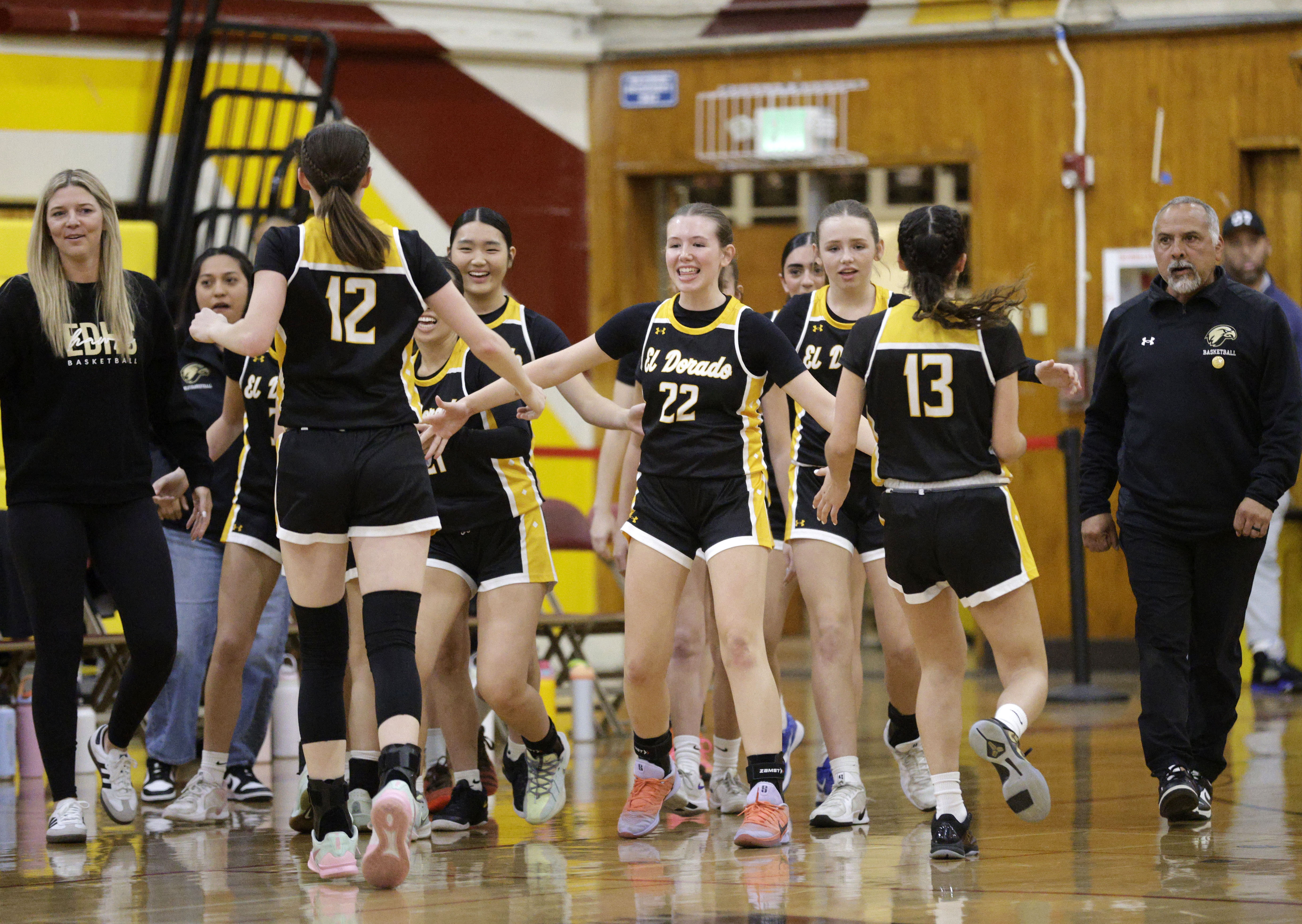 El Dorado girls basketball celebrate as they take a dominant...