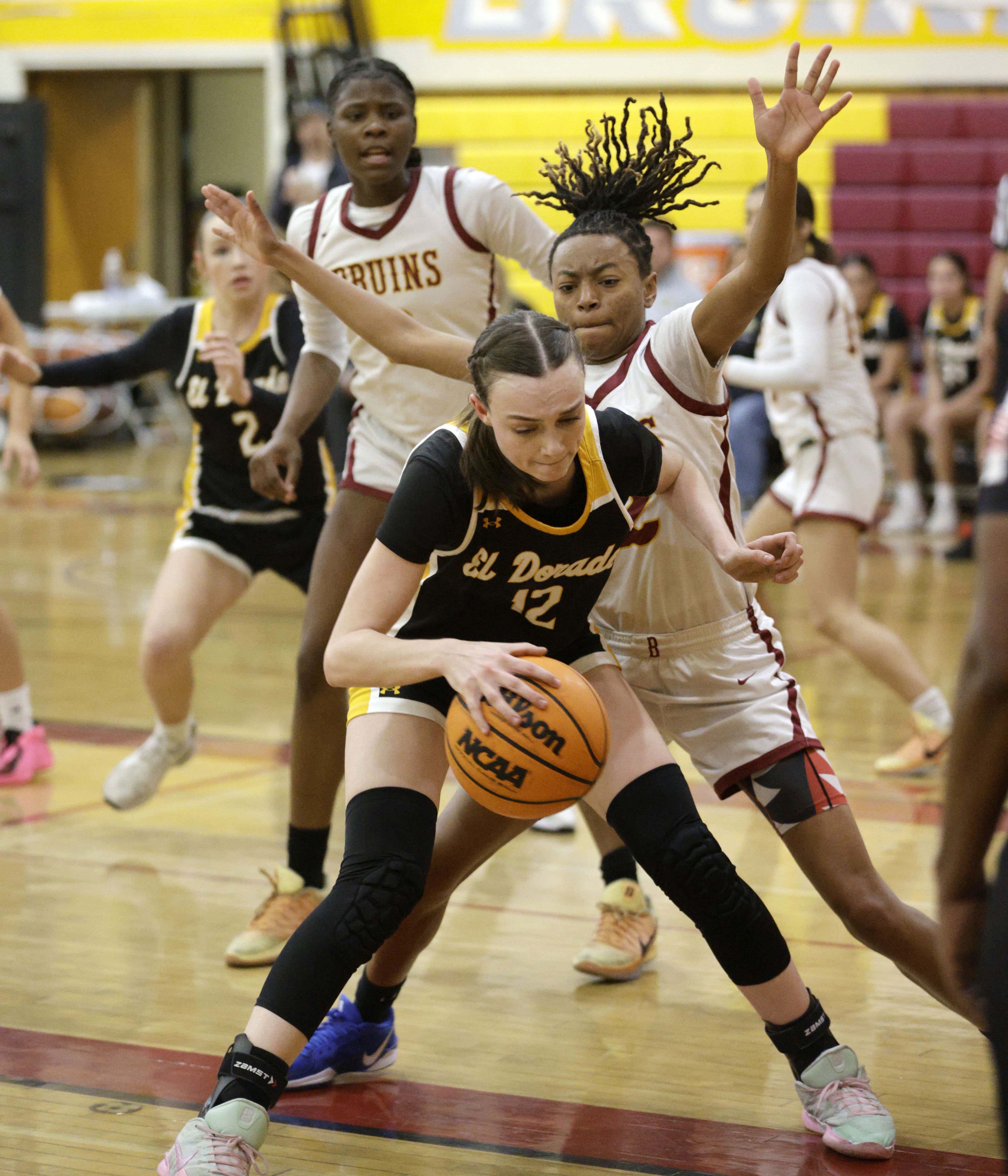 El Dorado’s Delaney Shiring (12) looks to get around Wilson’s...