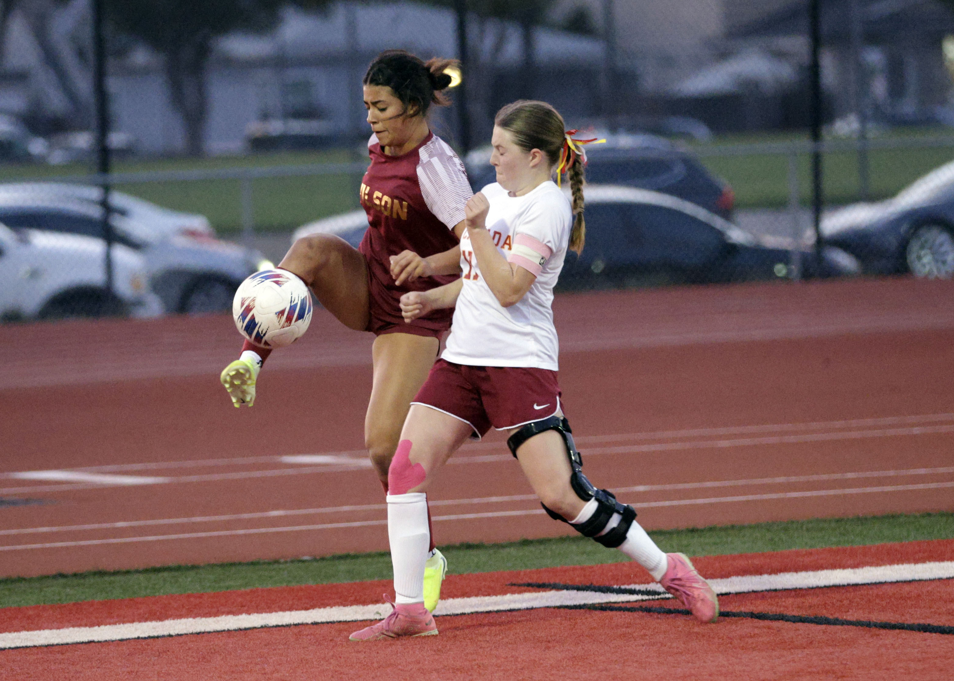Wilson’s Coco Gonzalez (18) kicks the ball away from La...