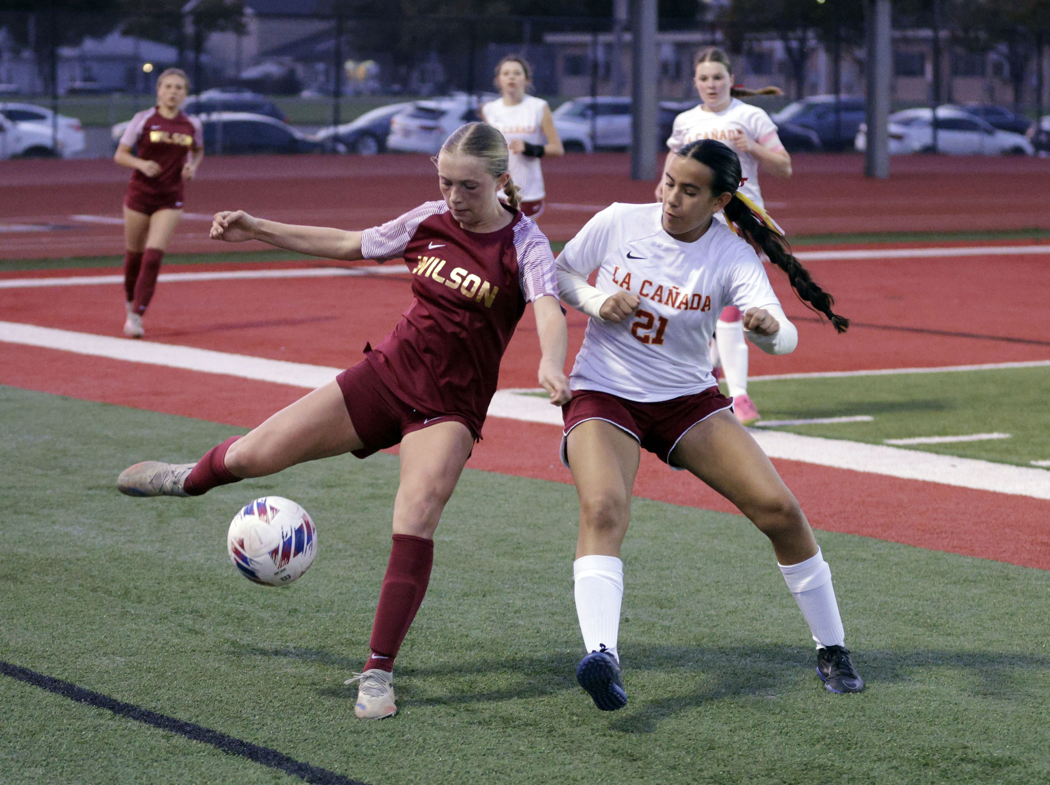 La Canada’s Andrea Server (21) looks to get the ball...