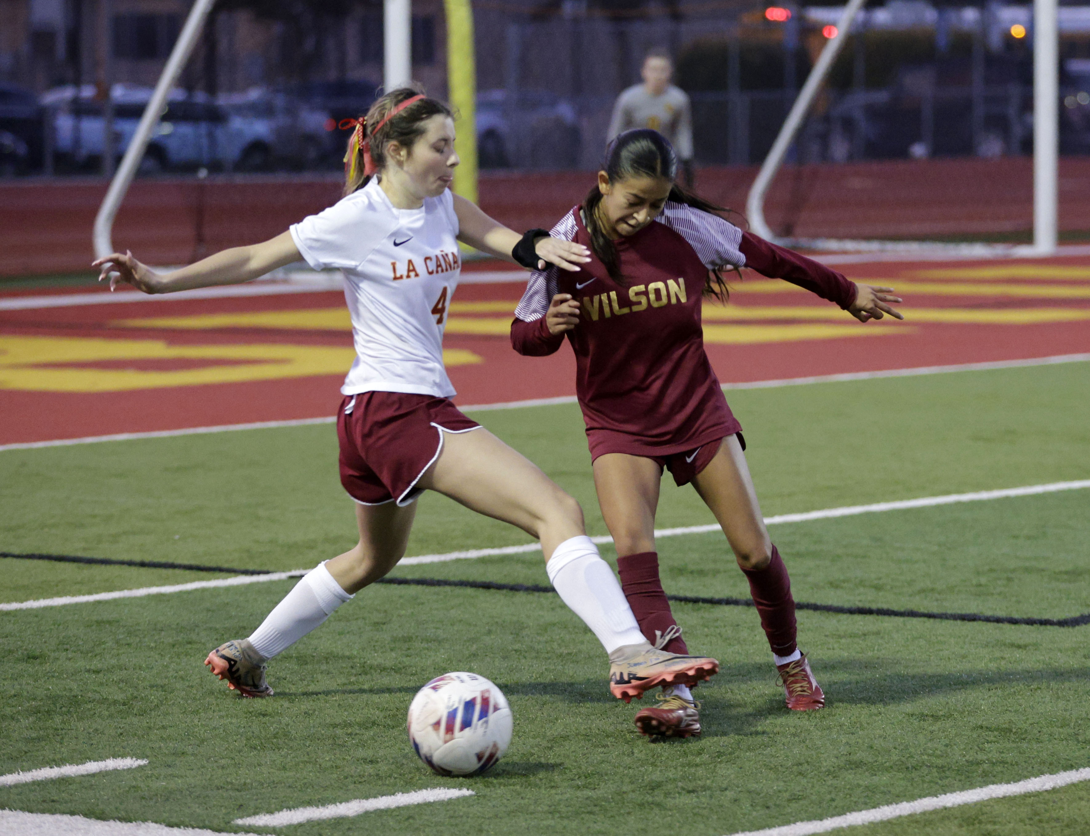 La Canada’s Caitlin Aguilar (4) and Wilson’s Brielle Abby Salazar...