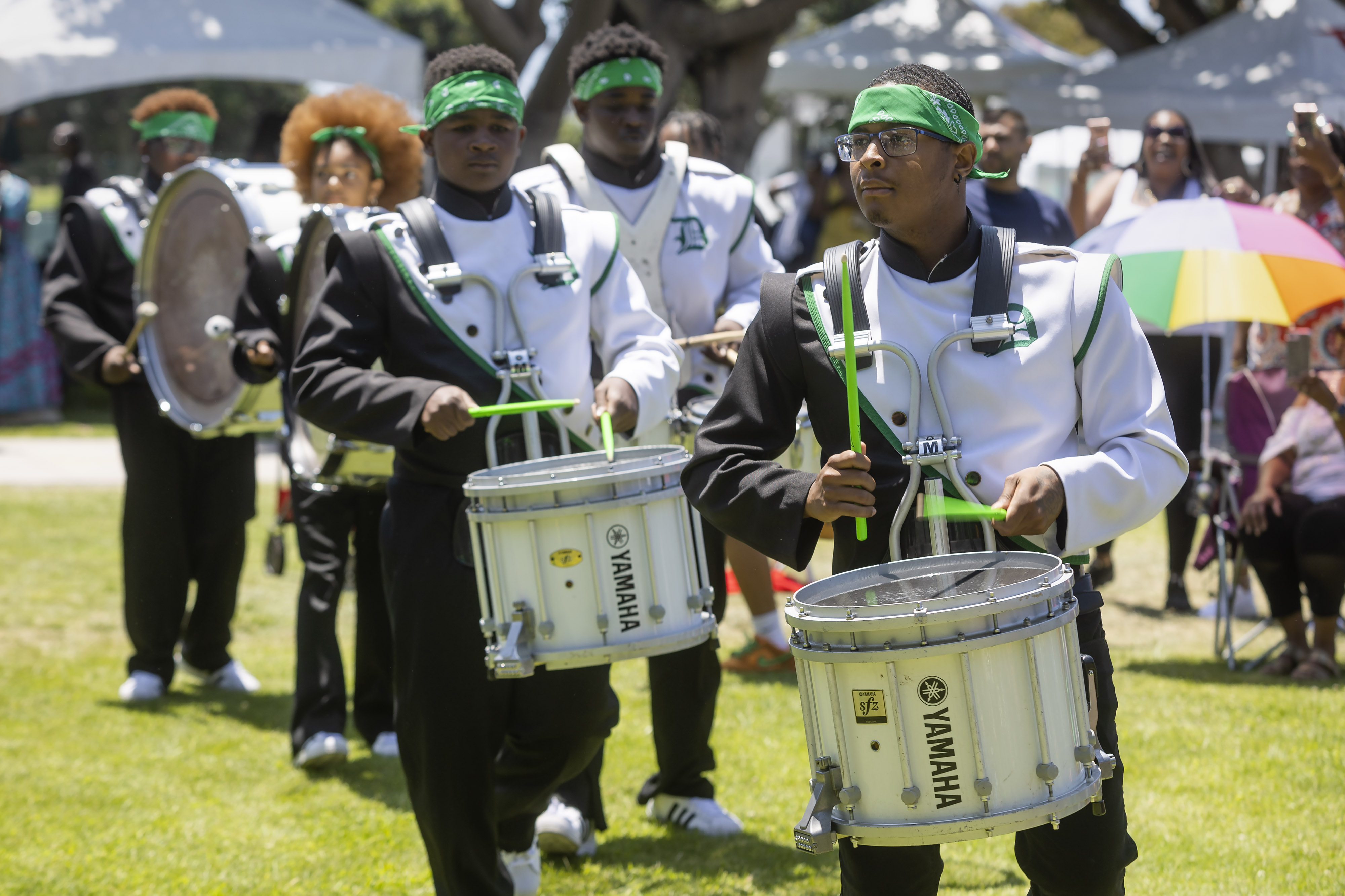 The Dorsey High School Drum-line and Drill Team perform during...