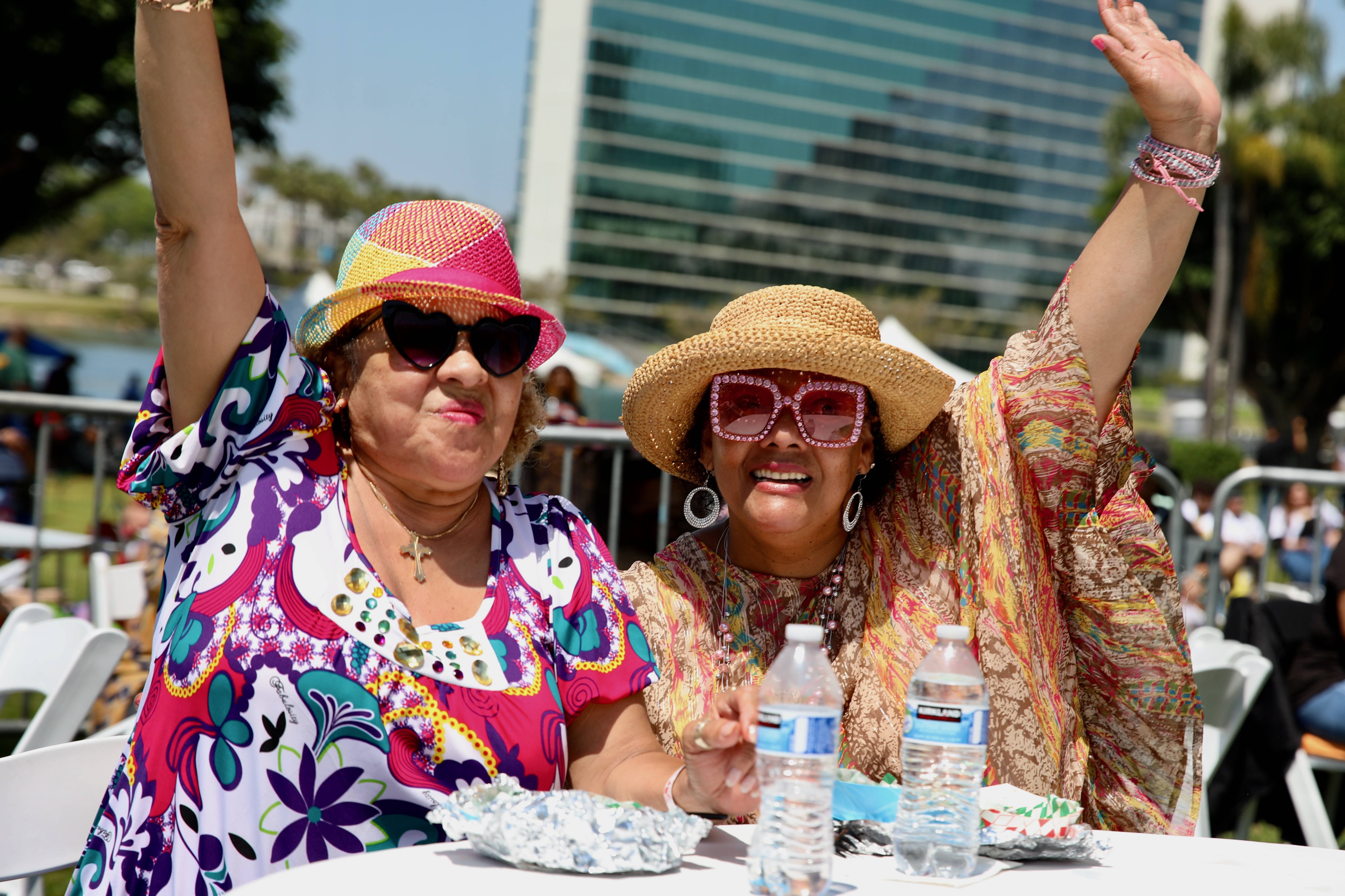 Severina Britto, left, and Muriel Clark sway to the music...