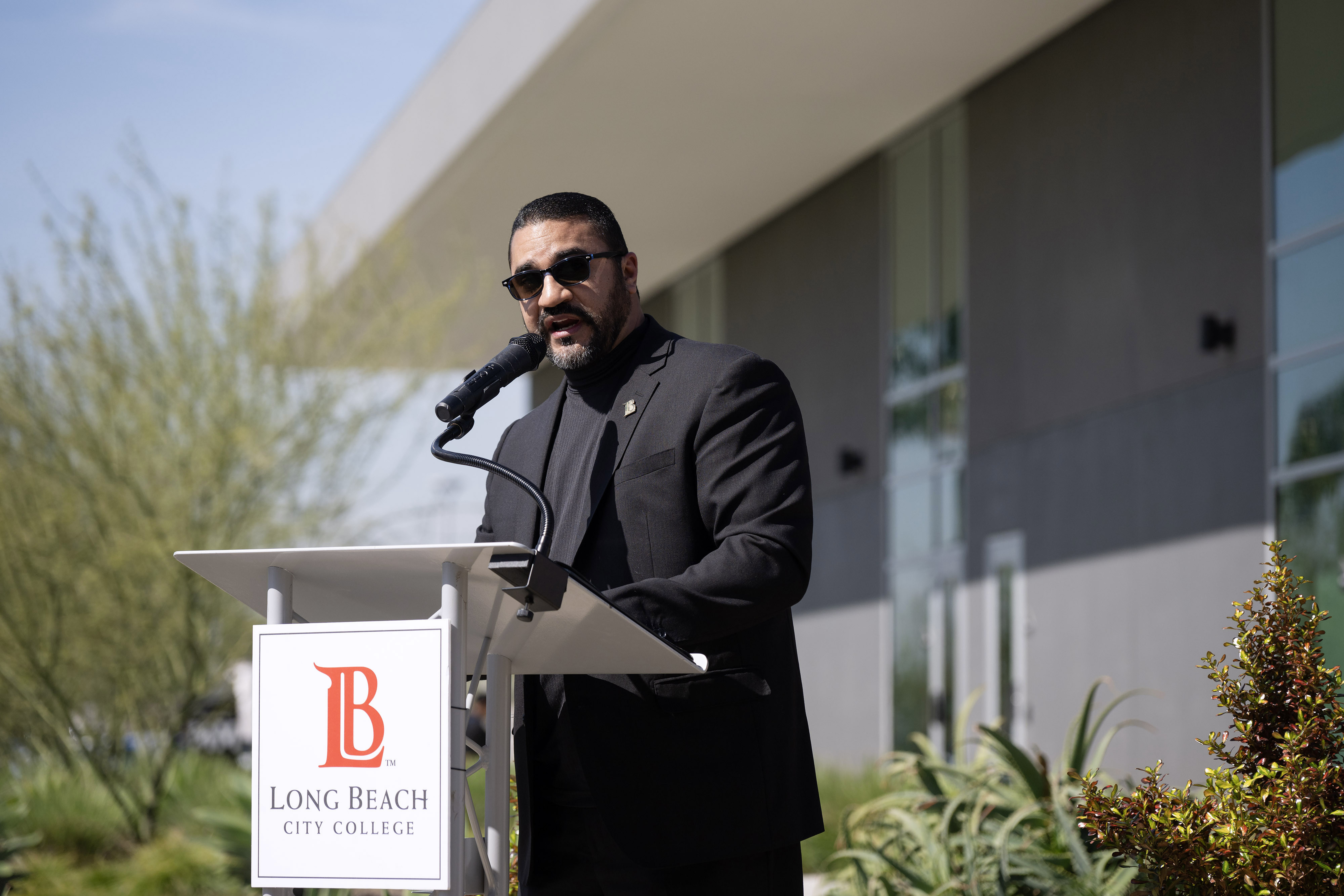Dr. Fawaz Al-Malood speaks during a ribbon-cutting ceremony to celebrate...