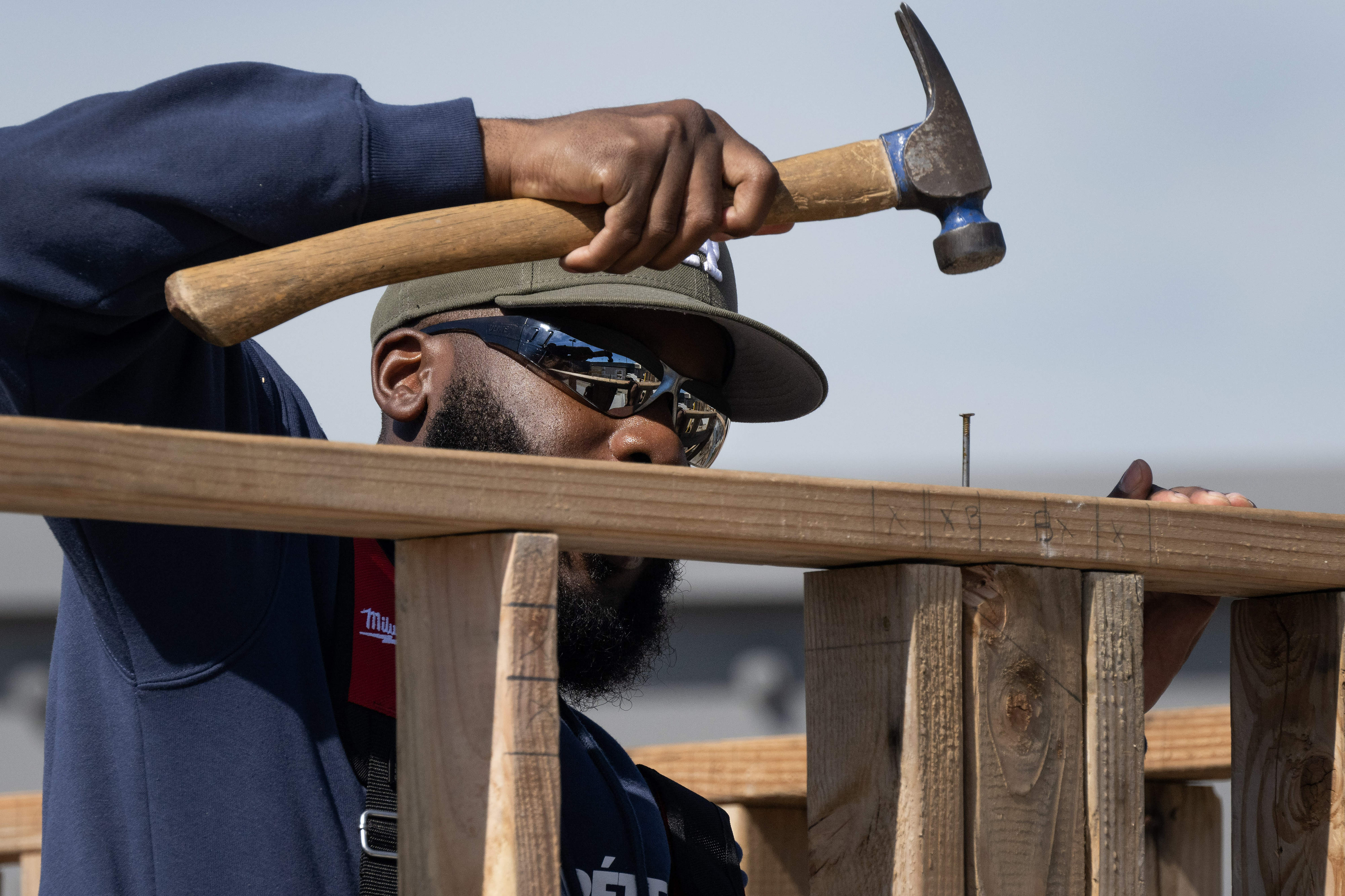 Troy Wells drives in a nail during his Construction 200...