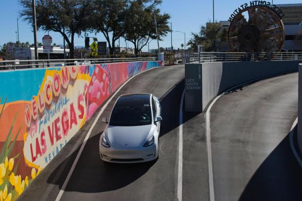 A Tesla is driven into the Vegas Loop under the city on Wednesday, Feb. 4, 2026, in Las Vegas. (AP Photo/Ty ONeil)