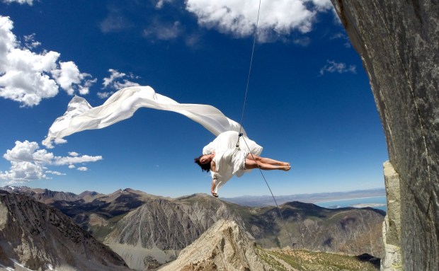 Amelia Rudolph, founder of Oakland dance company Bandaloop and A.R.M.A., performs in 2014 on Dana Pillar near Yosemite National Park in California. (Braden Mayfield)
