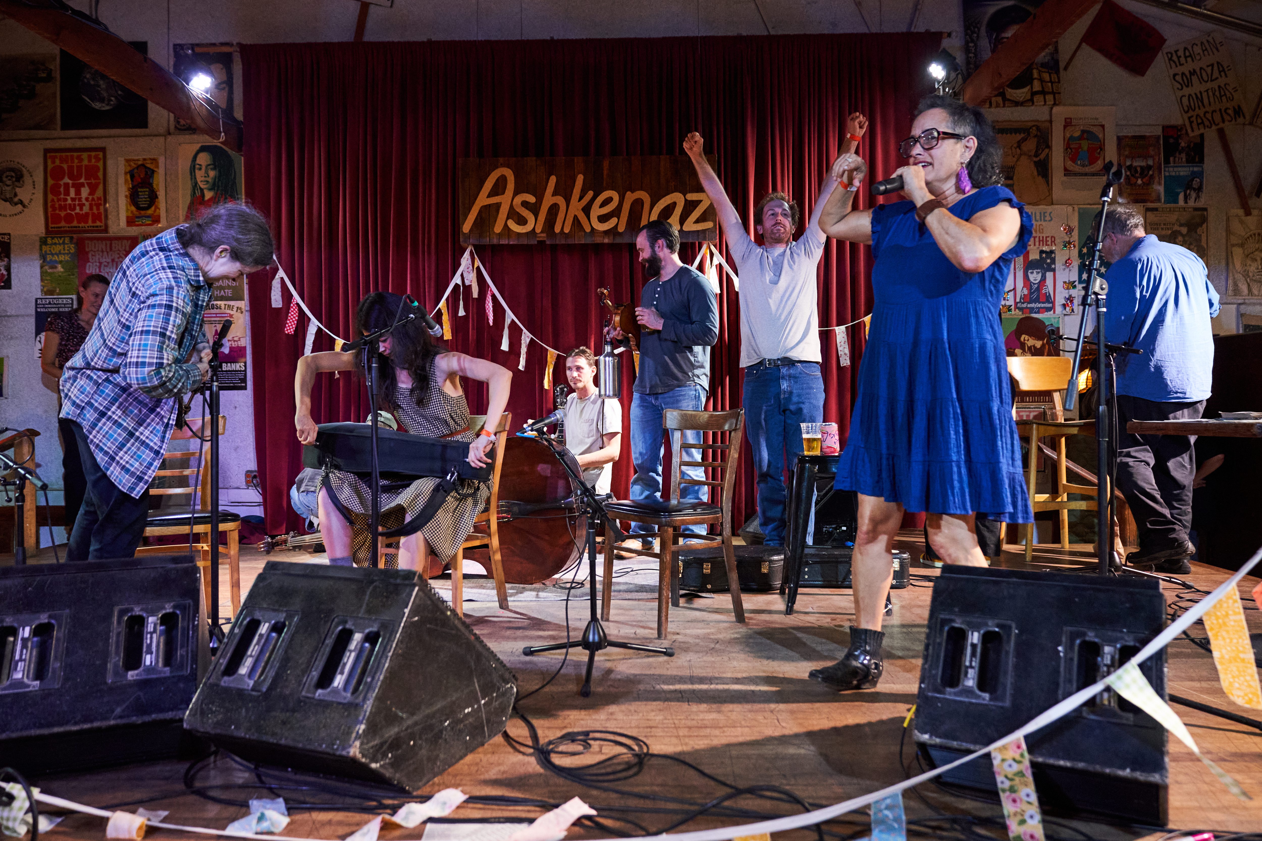 Organizer Evie Ladin, right, addresses participants as Portlandâs Stumptown String...
