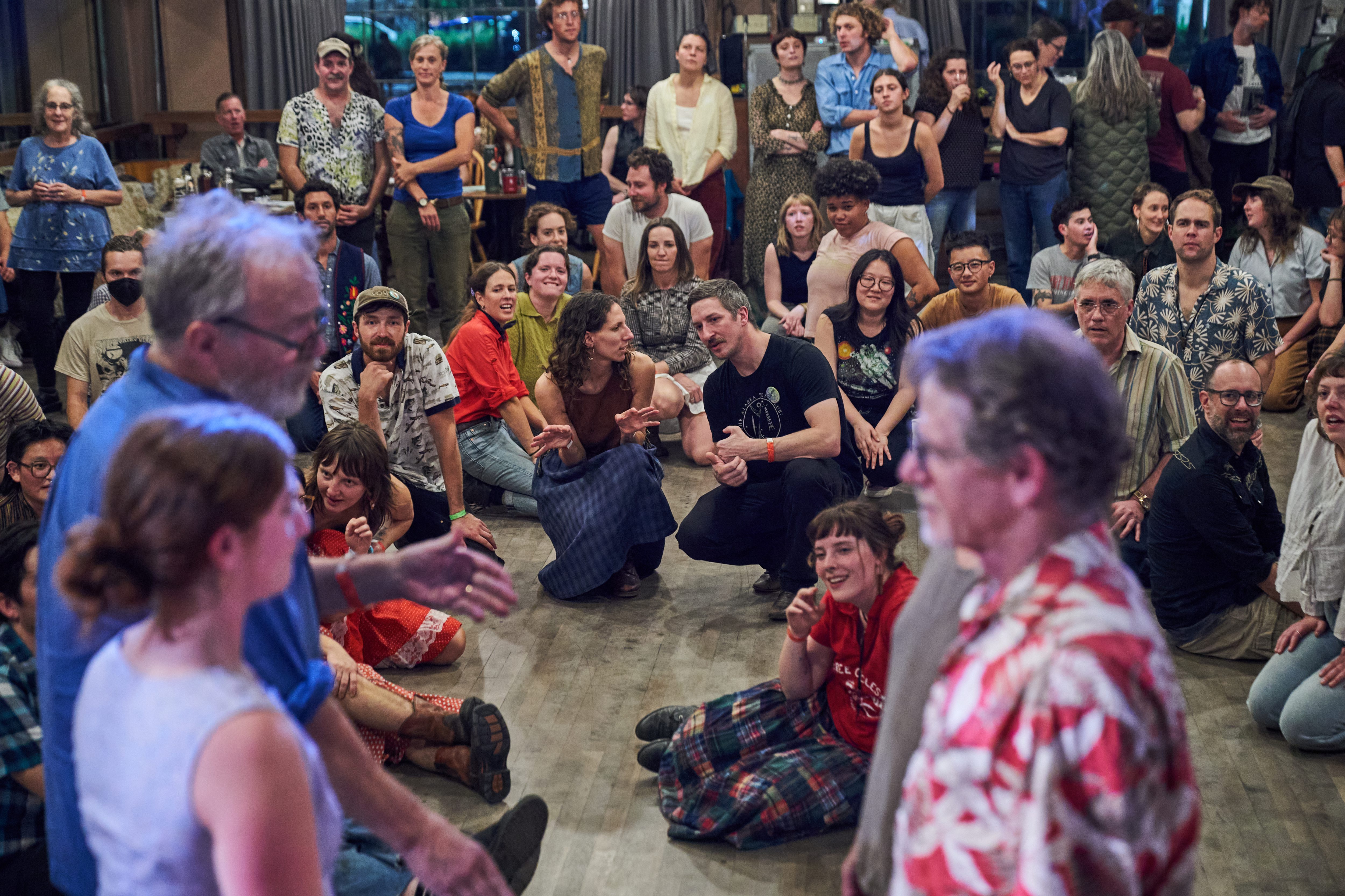 Participants watch a demonstration for the following dance during the...