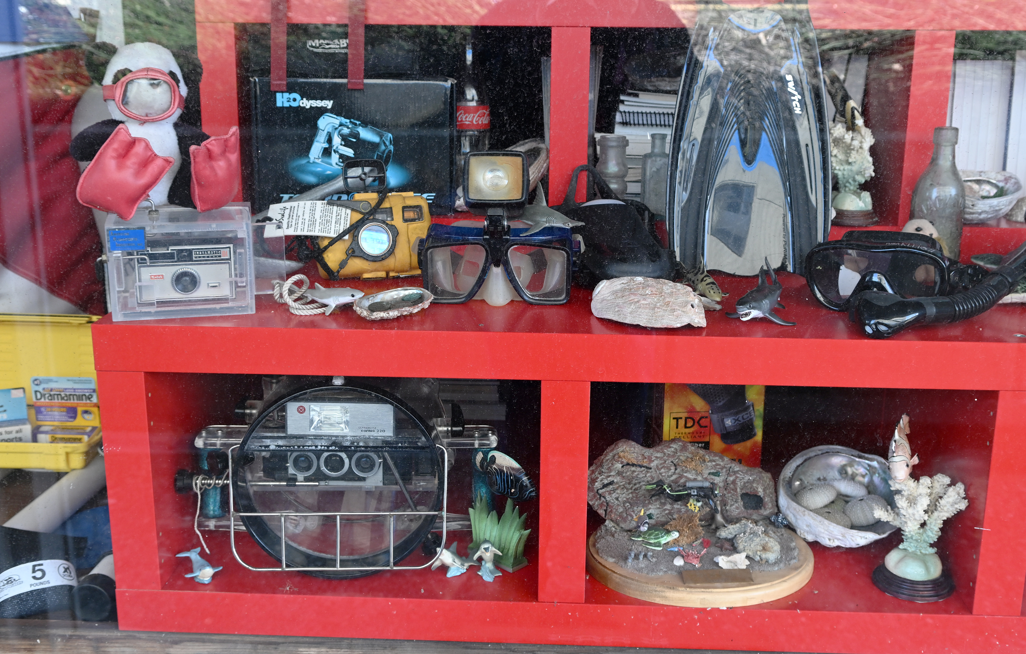 Underwater gear and other items are displayed in the shop...
