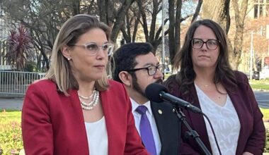Assemblymember Maggy Krell, D-Sacramento, discusses a lawsuit demanding federal compliance with two Freedom of Information Act requests she filed regarding federal immigration enforcement activity at Sacramento’s John Moss Federal Building. With Krell at a news conference on Thursday are Sacramento Councilman Eric Guerra and Jessie Mabrey, CEO of the refugee and immigrant rights group Opening Doors.