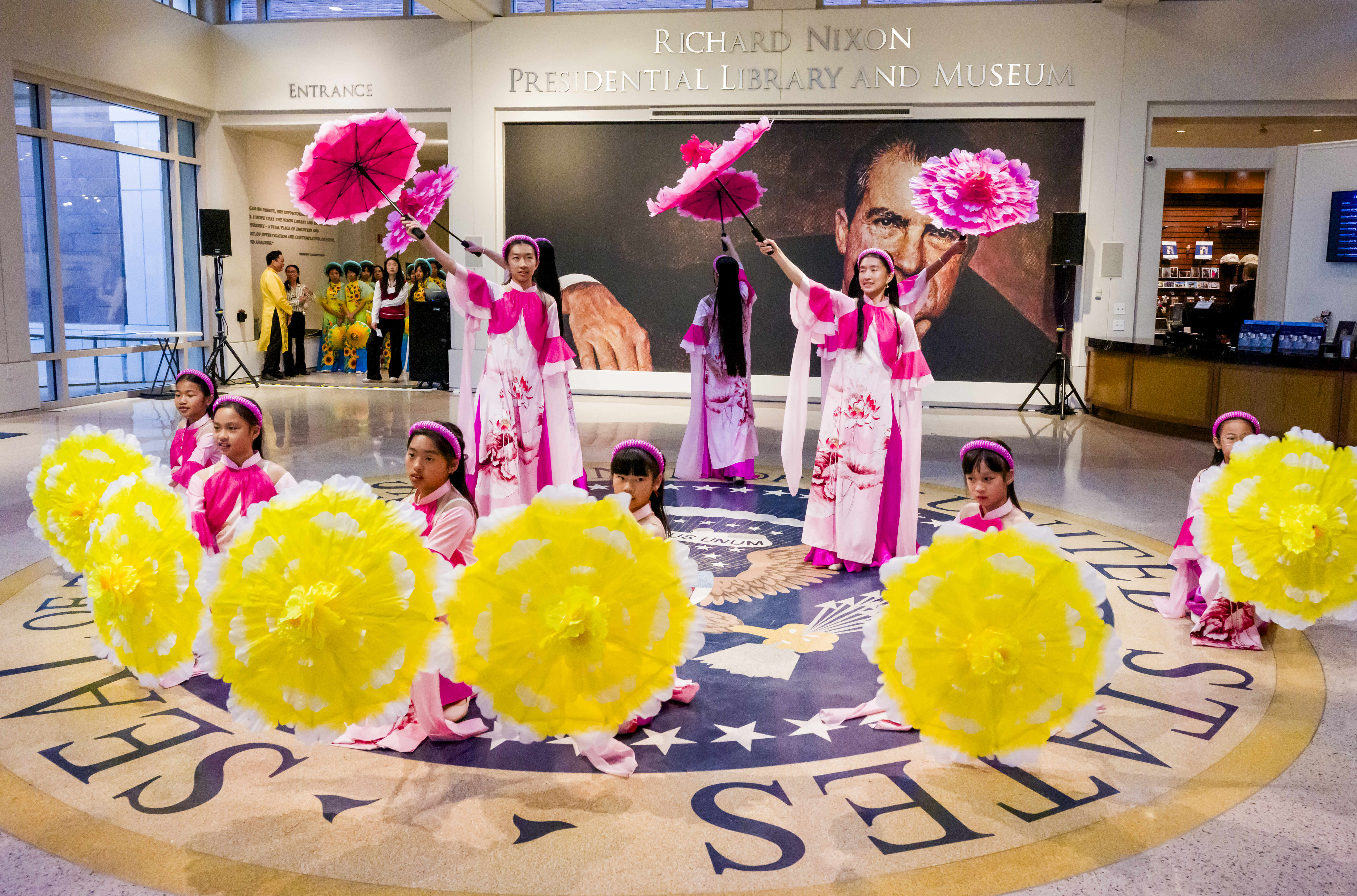 Traditional dancers perform in the lobby at the Richard Nixon...