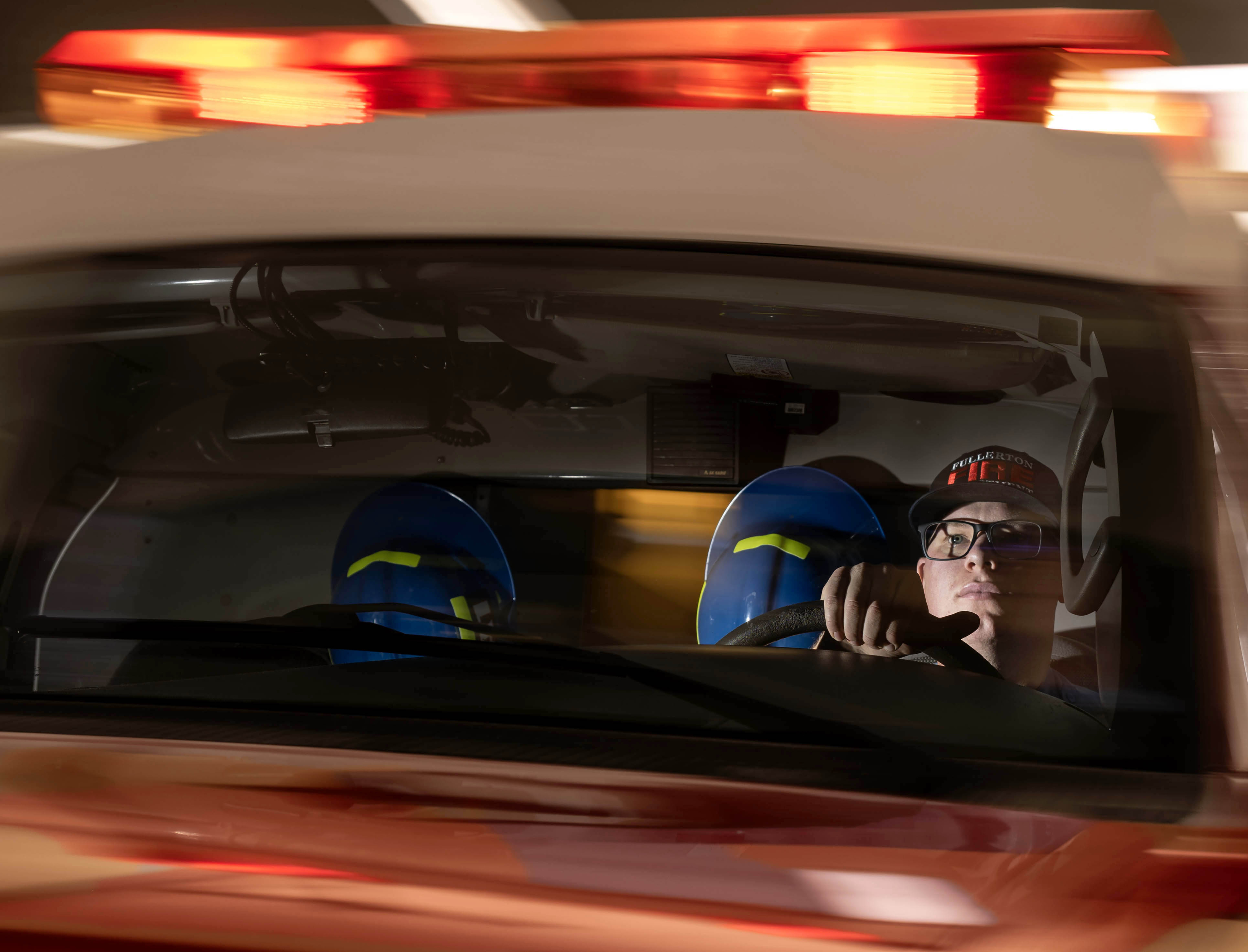 Fullerton Fire Department ambulance operator Patrick Manfredi sits inside an...