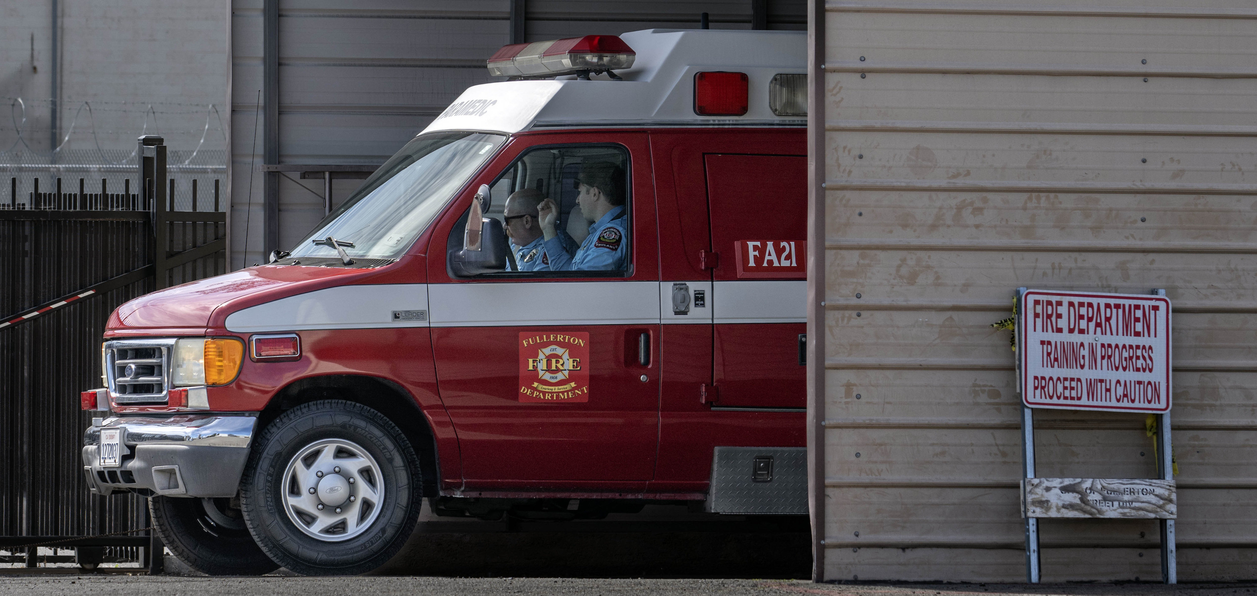 Fullerton Fire Department ambulance, borrowed from the OCFA, rolls out...